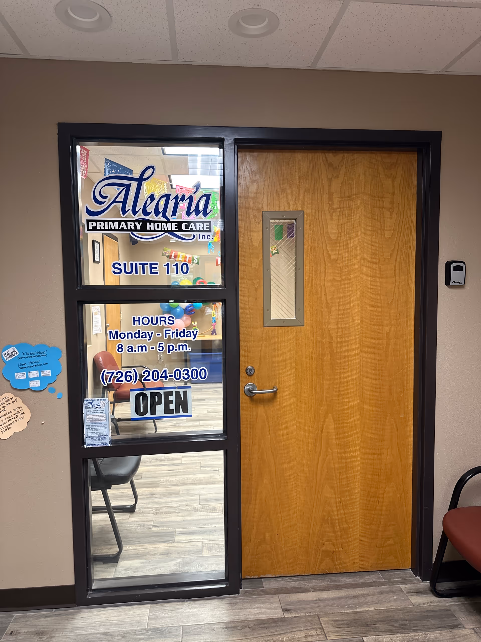 Door with glass panels and Alegria Primary Home Care signage, Suite 110, hours and OPEN sign.