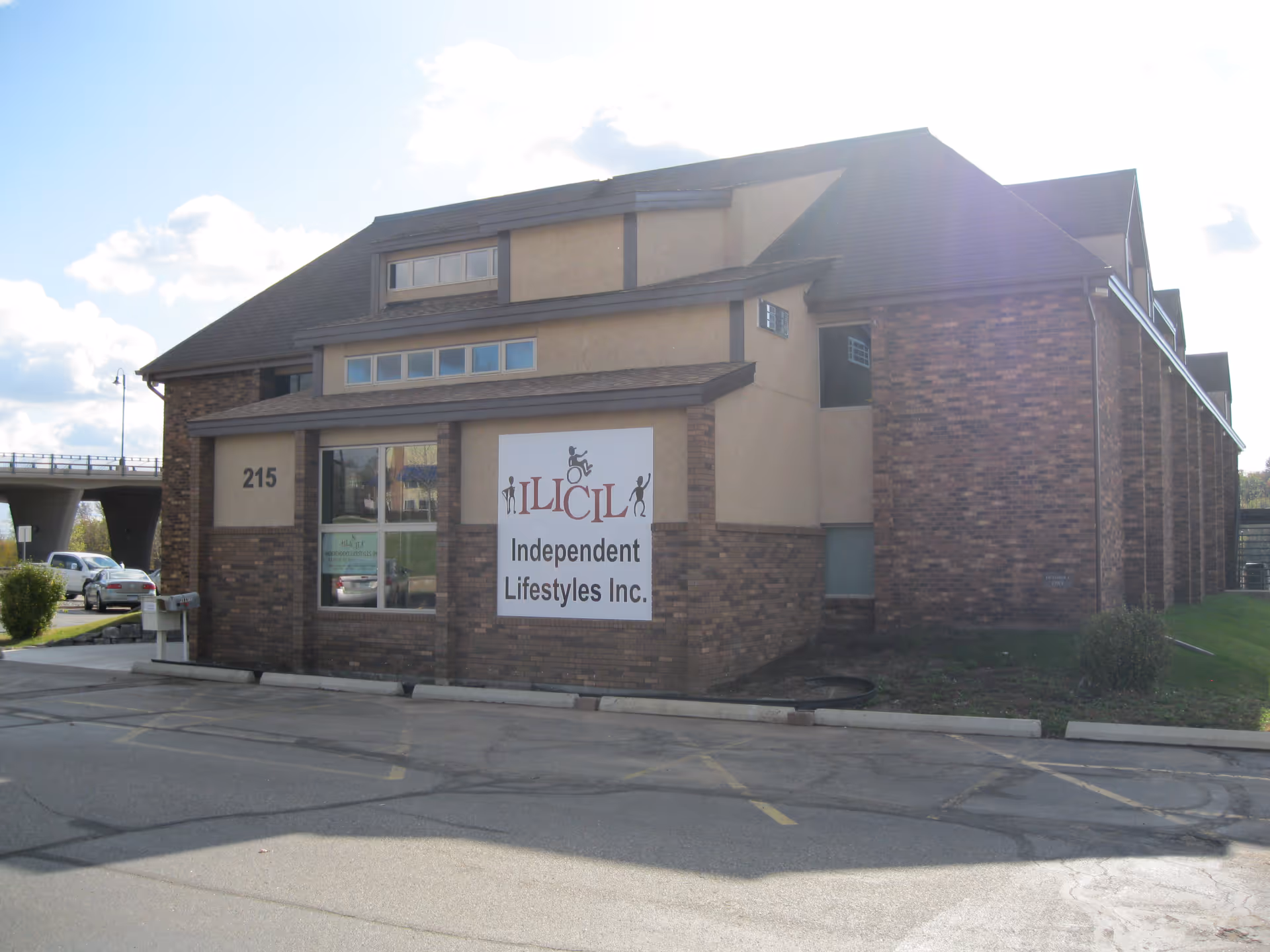 Brick facility exterior with a large sign: Independent Lifestyles Inc.