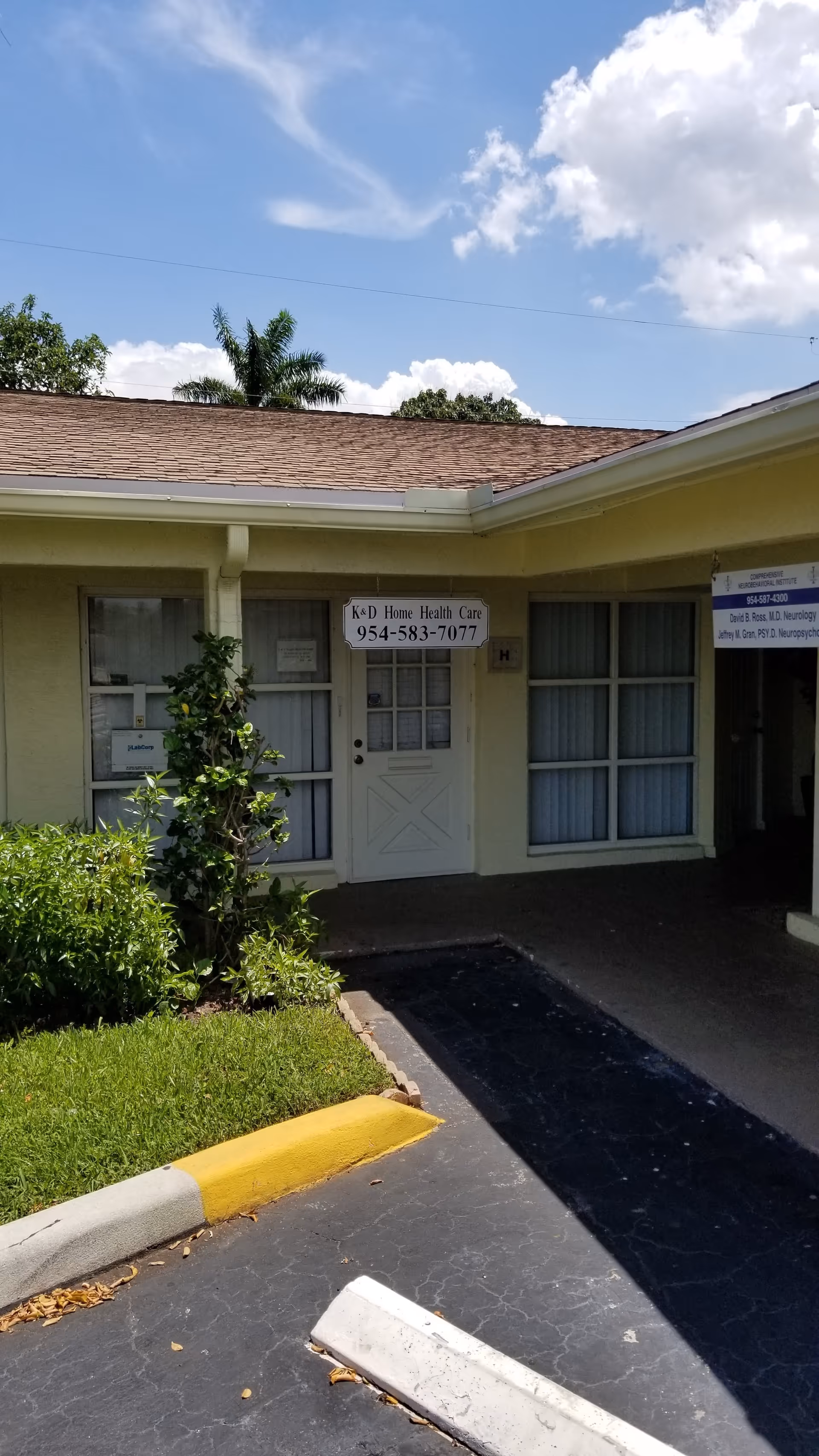 Front exterior of a single-story building with K & D Home Health Care sign at entrance.