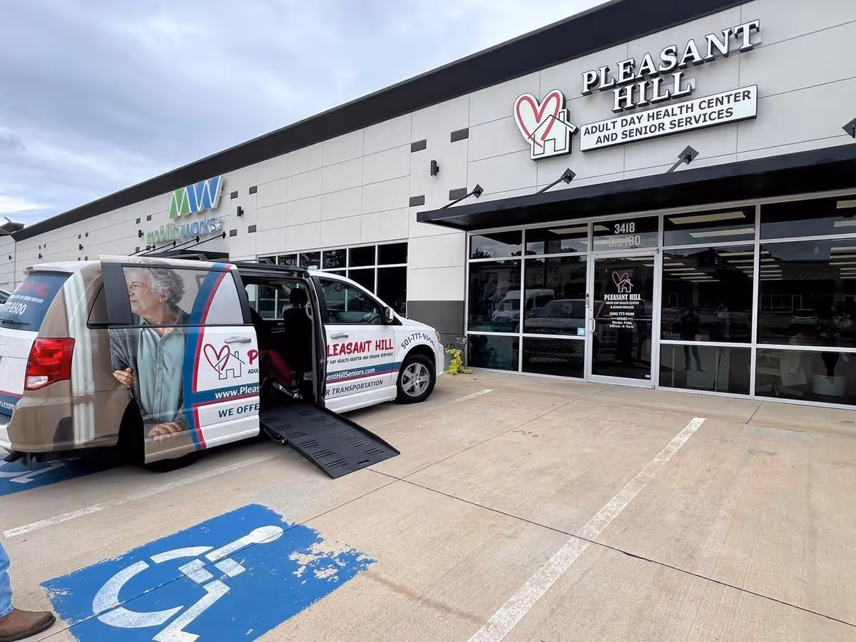Exterior view of Pleasant Hill facility with a branded van parked outside.
