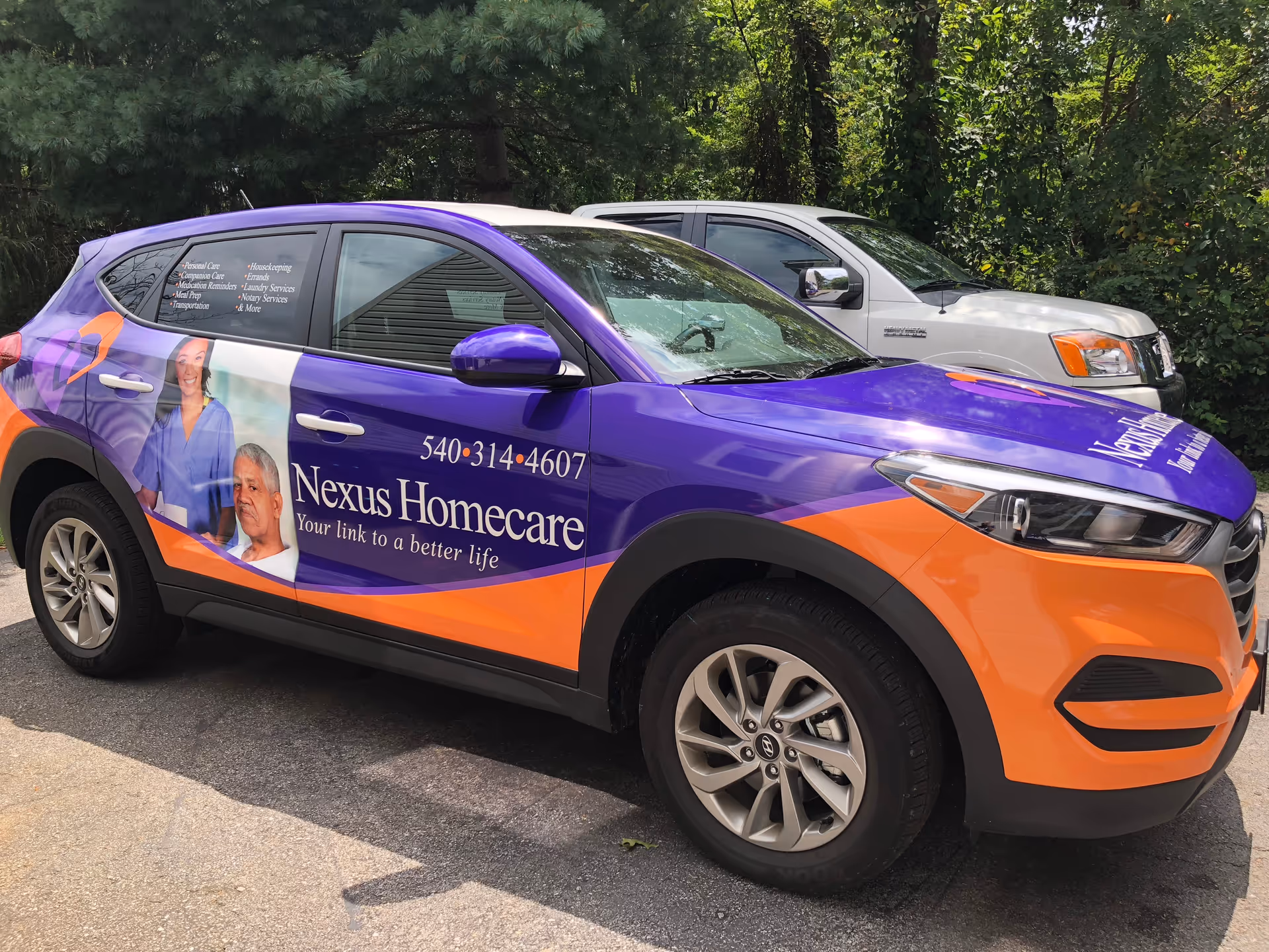 Purple Nexus Homecare van with orange accents parked outdoors.