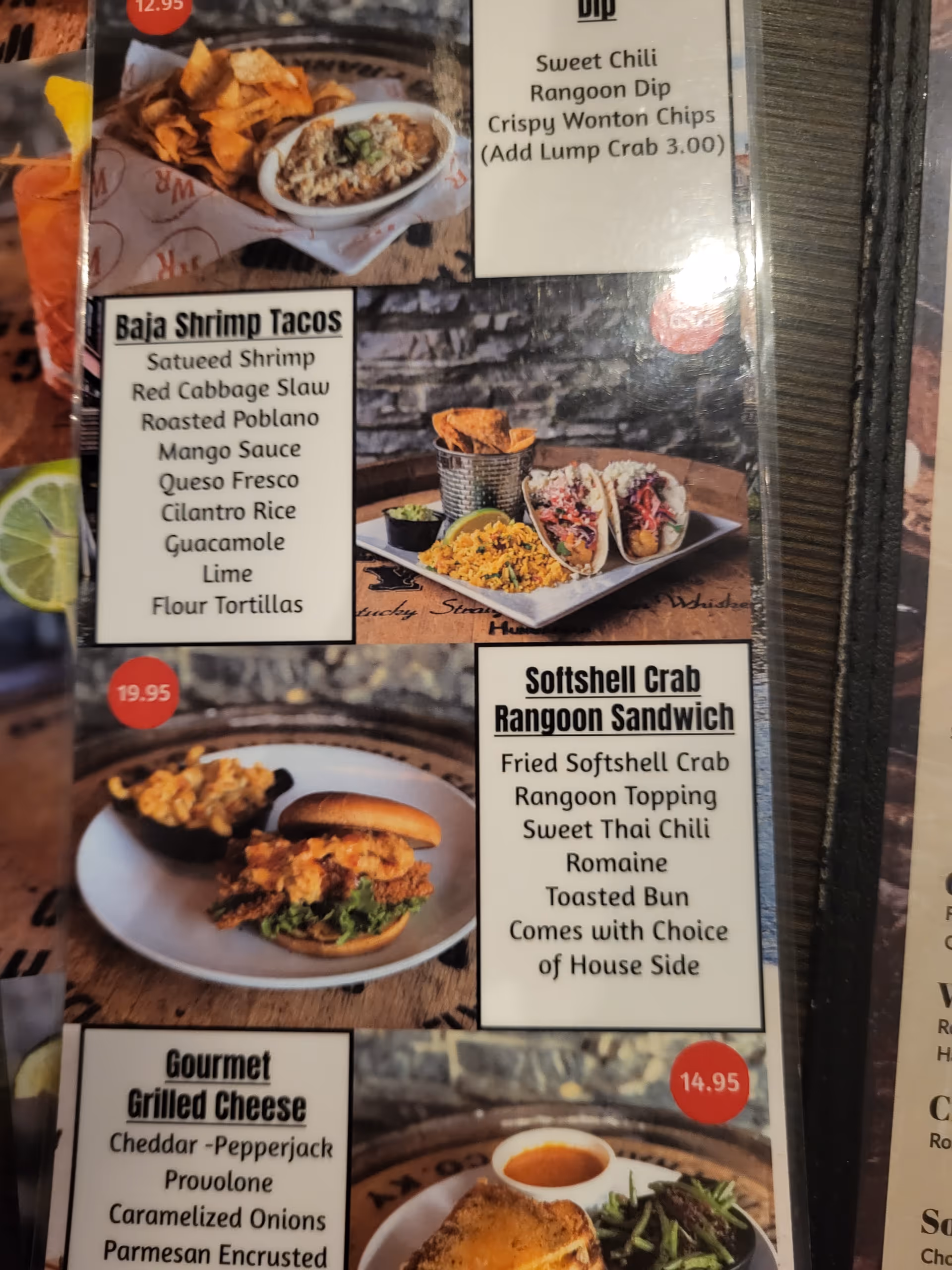 Close-up of a dining menu board displaying various dishes and images