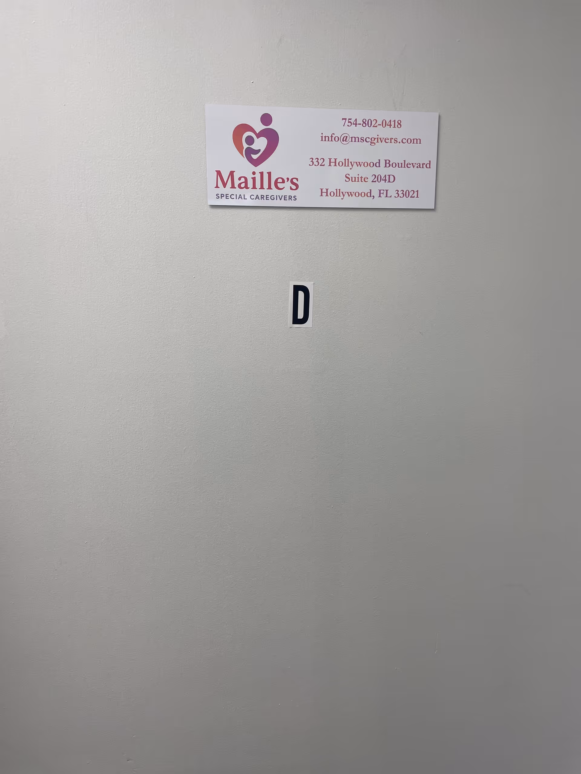 Interior wall with Maille's Special Caregivers sign and a 'D' label.