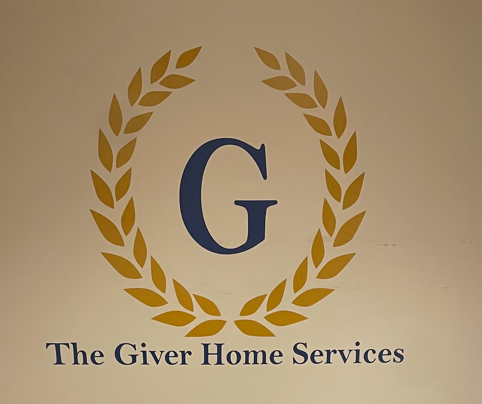 Large blue 'G' surrounded by gold laurel wreath and 'The Giver Home Services' text.