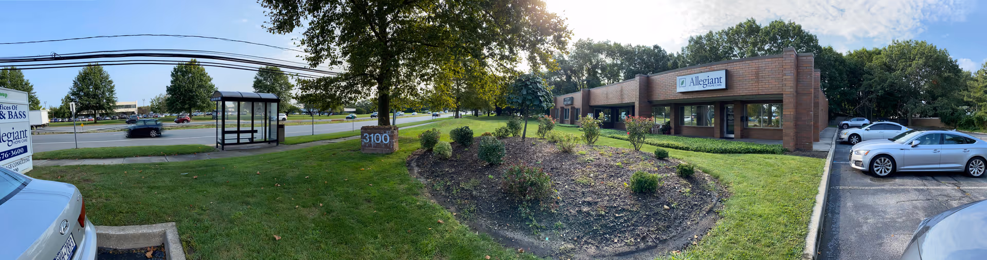 Exterior view of Allegiant Home Care building with parking lot and landscaping.