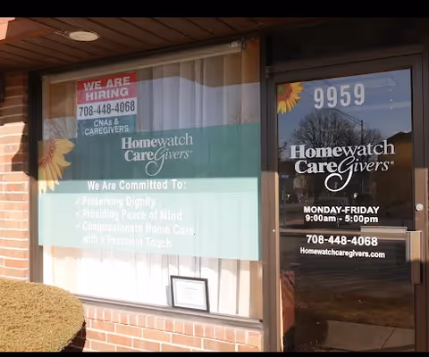 Front exterior of Homewatch CareGivers of Hickory Hills with a 'We Are Hiring' sign.