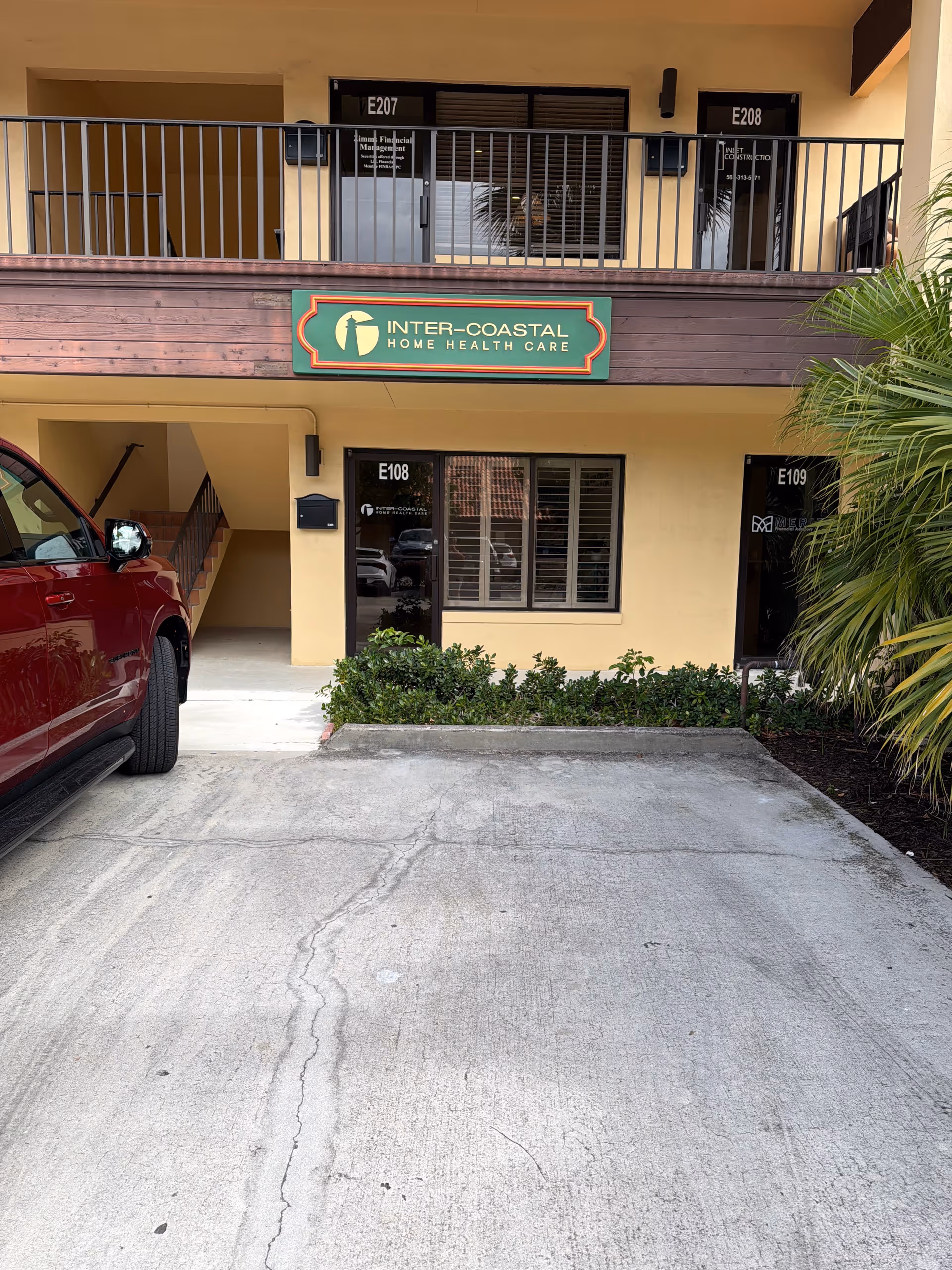 Exterior view of Inter-Coastal Home Health Care building with sign and parking area.