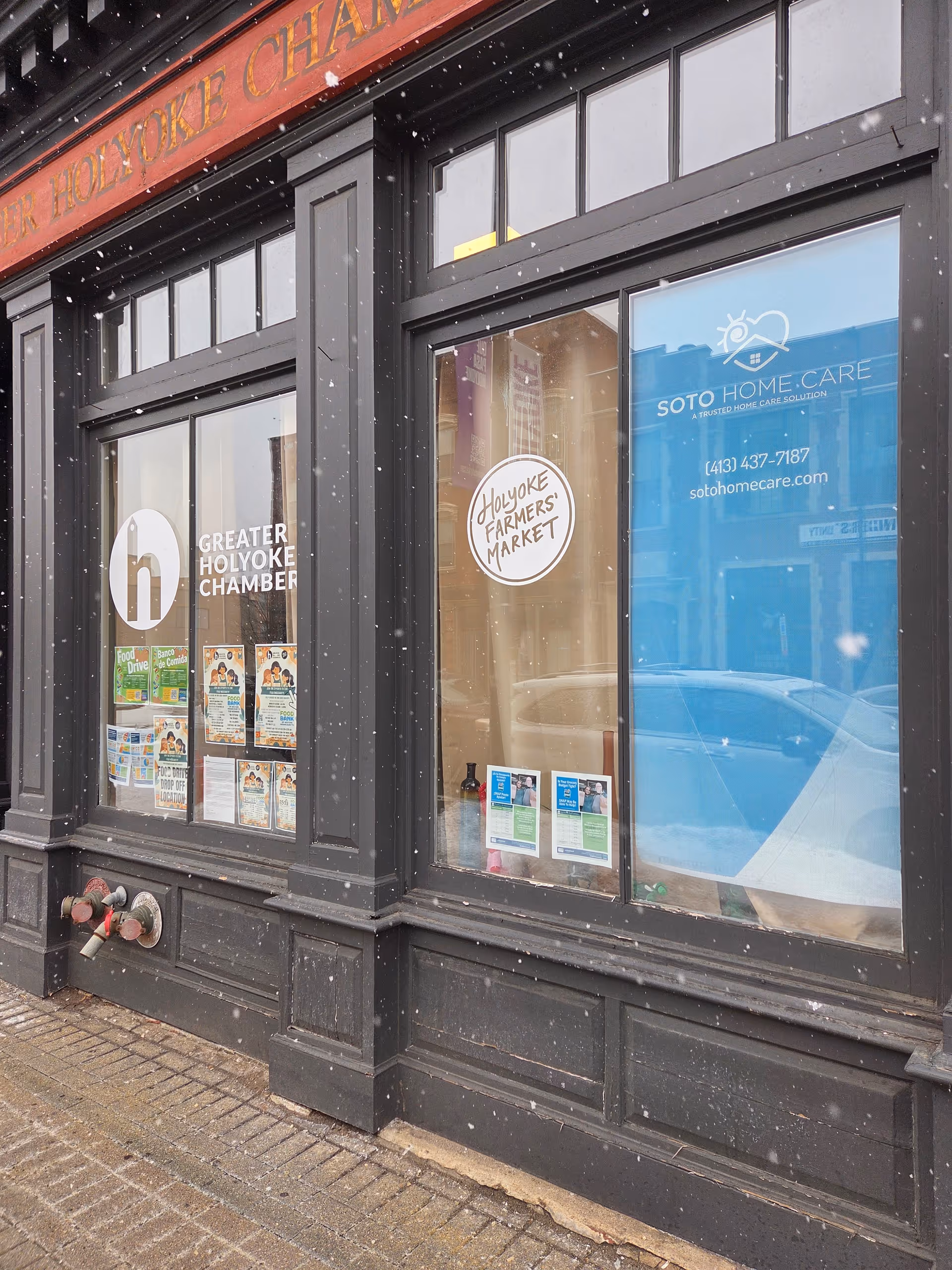 Exterior storefront of Soto Home Care, Inc. with windows and visible signage in light snow.