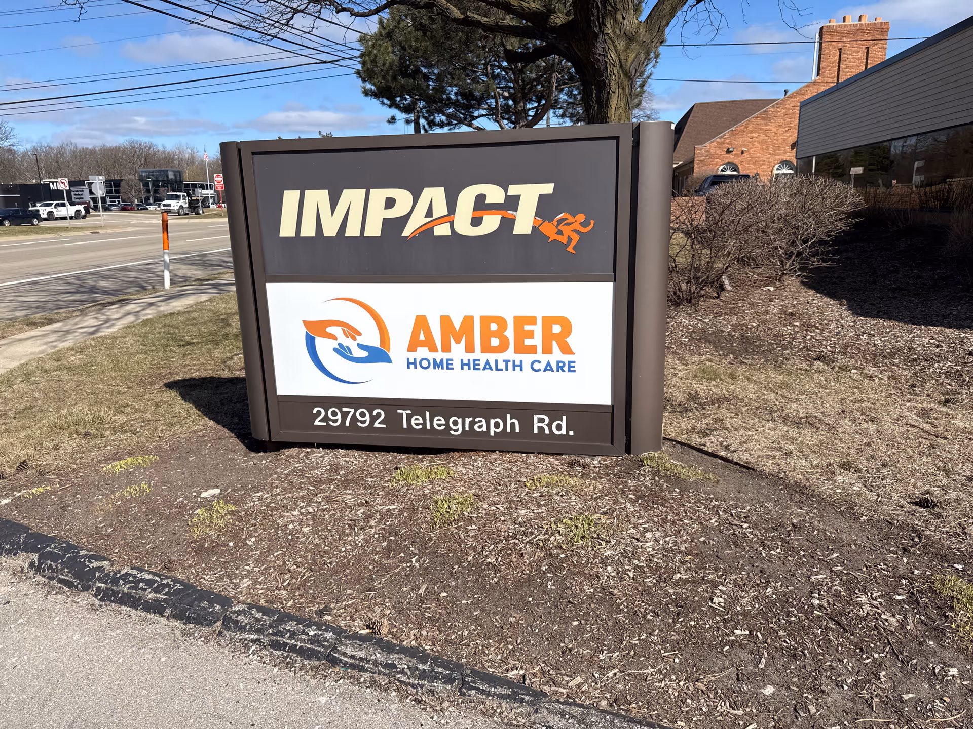 Outdoor sign for Amber Home Health Care with IMPACT logo and 29792 Telegraph Rd.