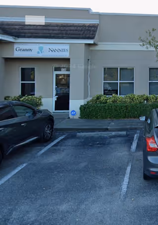 Front exterior view of Granny NANNIES Home Care Fort Myers with cars in parking lot.