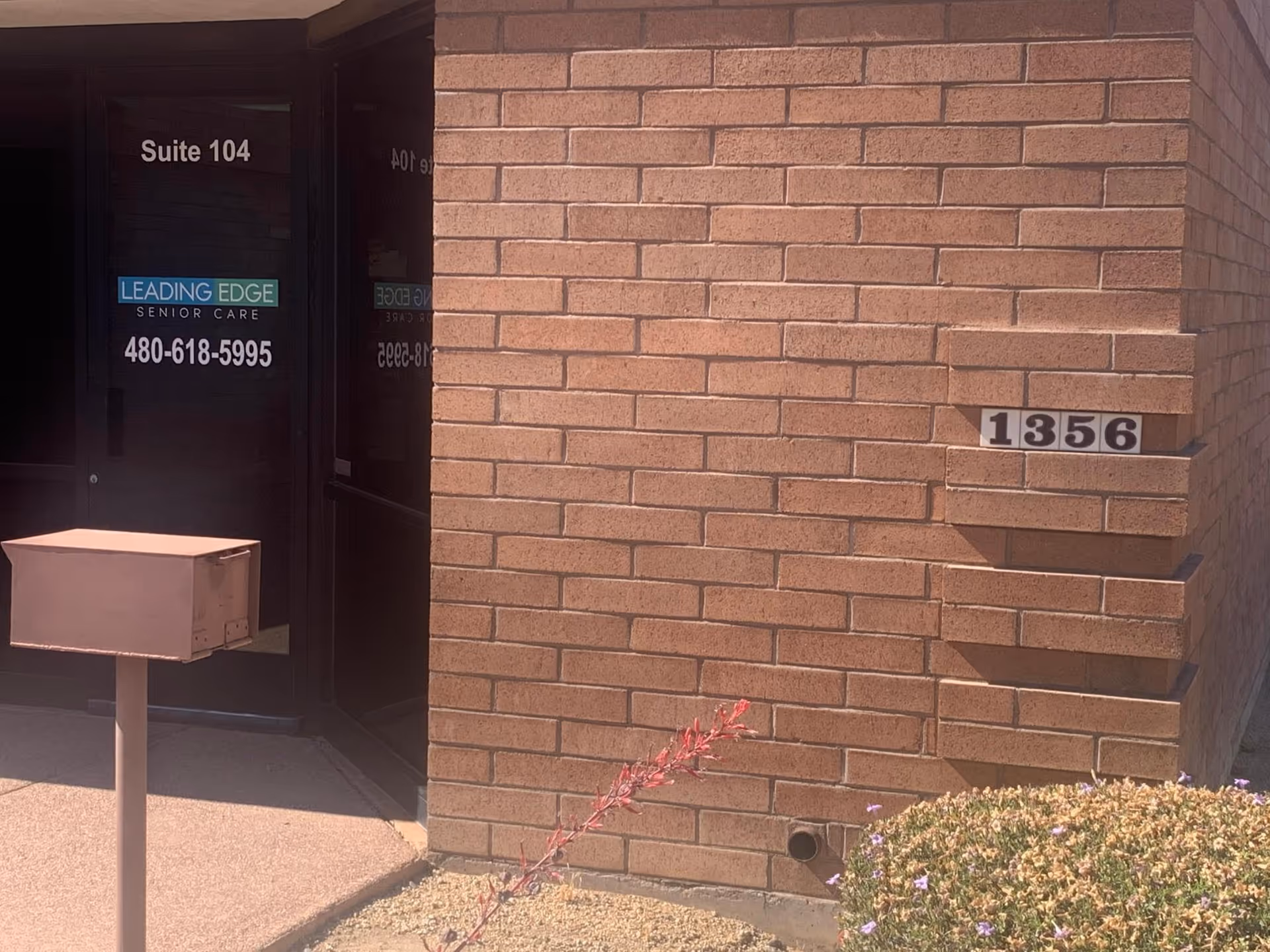 Brick exterior front entrance of Leading Edge Senior Care, Suite 104, address 1356.