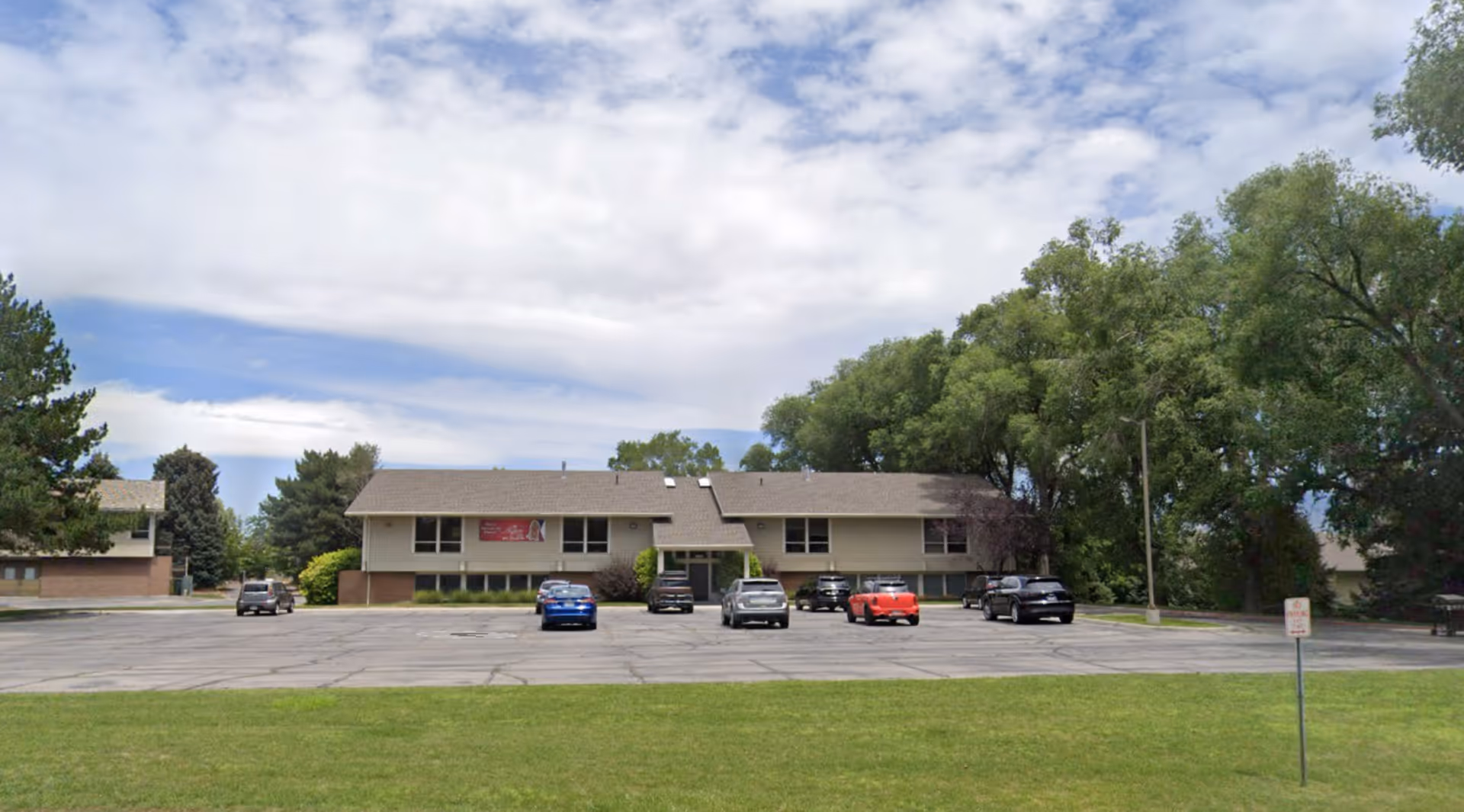 Aspire Home Health and Hospice building with a parking lot in front.