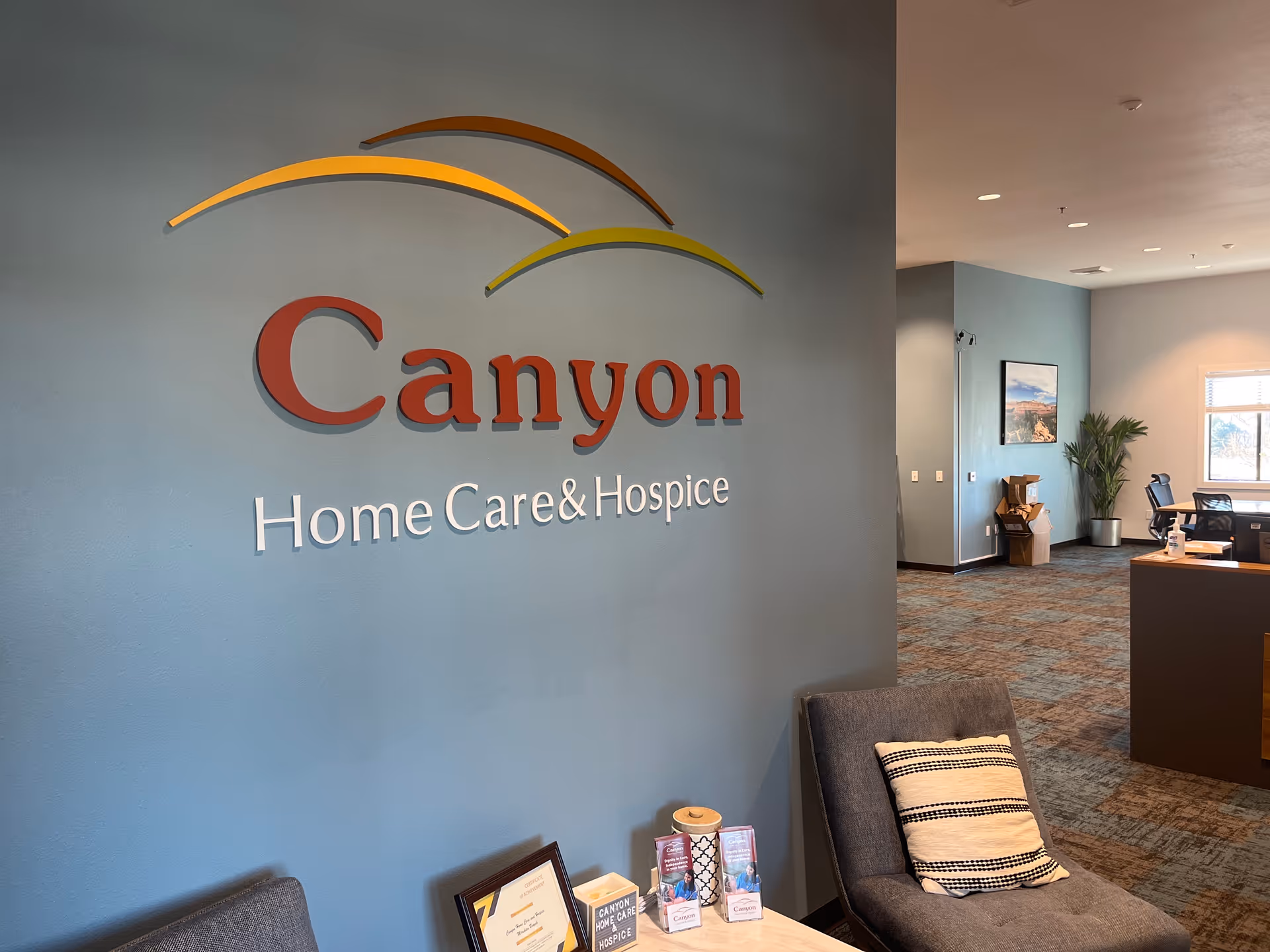 Lobby area of Canyon Home Care and Hospice with seating and a reception desk.