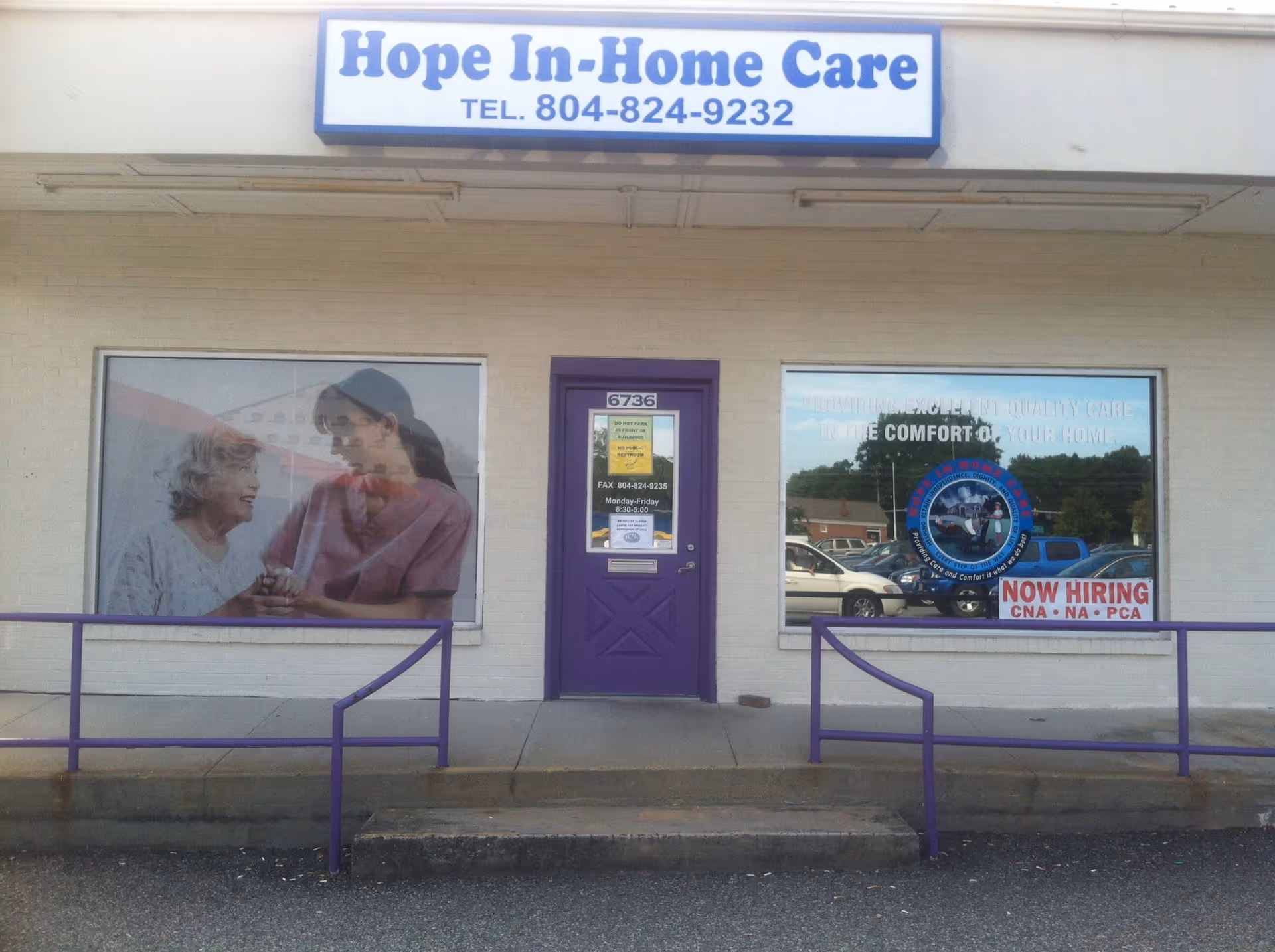 Front view of Hope In-Home Care storefront with purple door and large window ads.