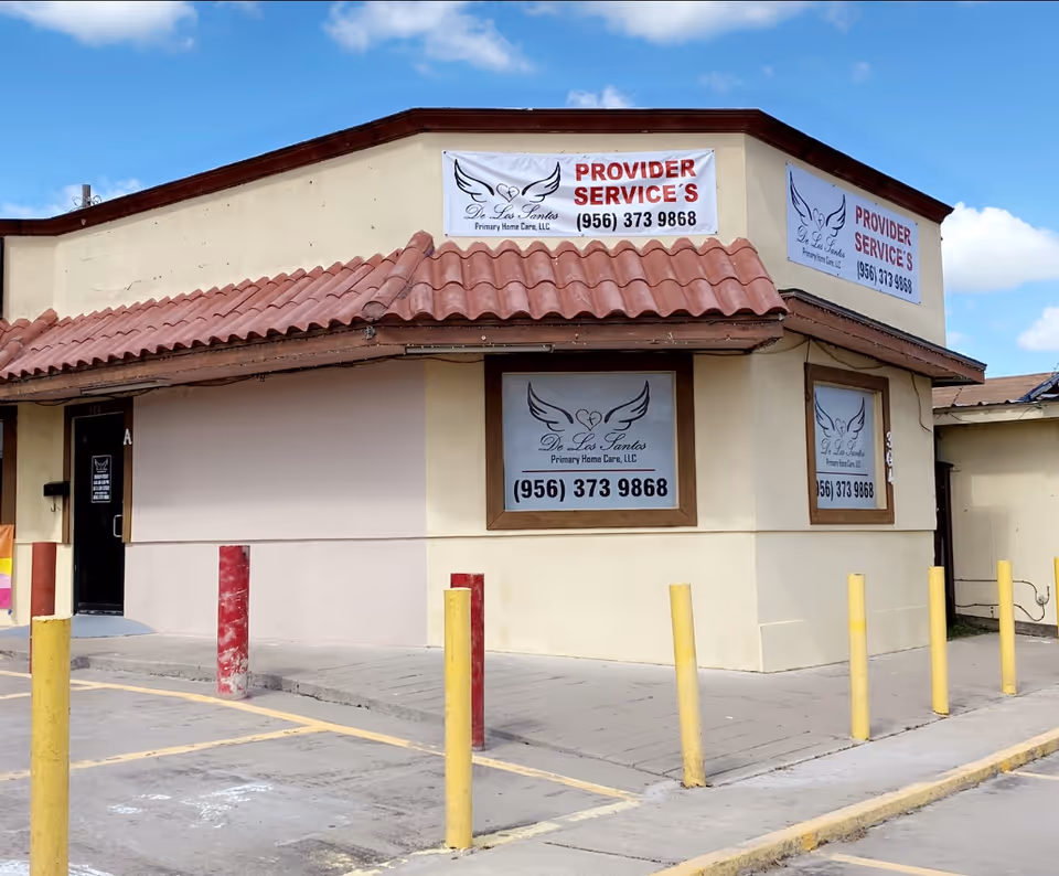 Exterior view of De Los Santos Primary Home Care, LLC, with signage and parking