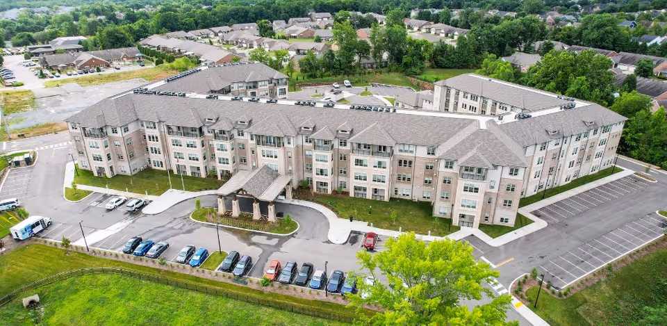 Aerial view of Harmony At Mt. Juliet senior living building with parking.
