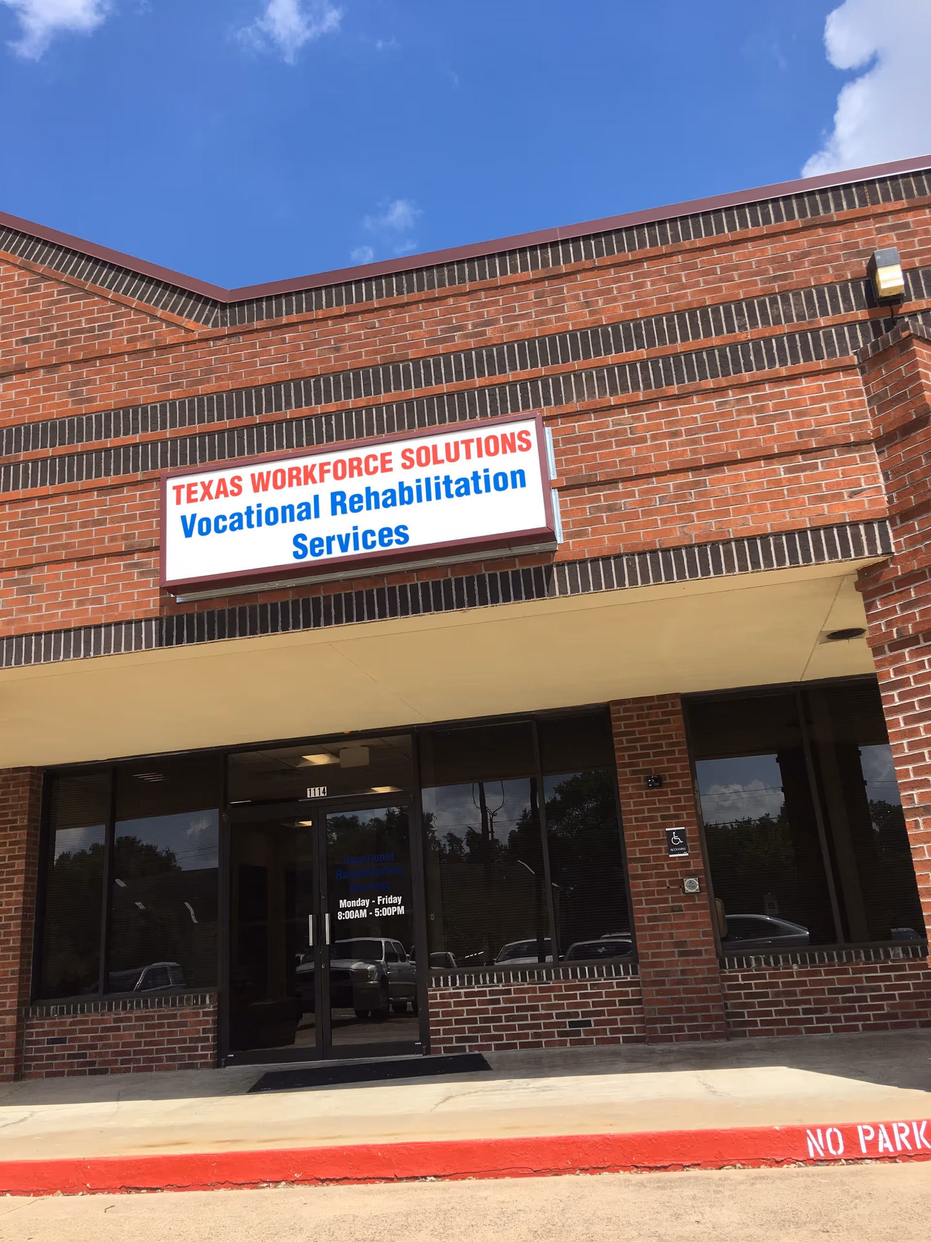 Brick exterior building with a Texas Workforce Solutions Vocational Rehabilitation Services sign.