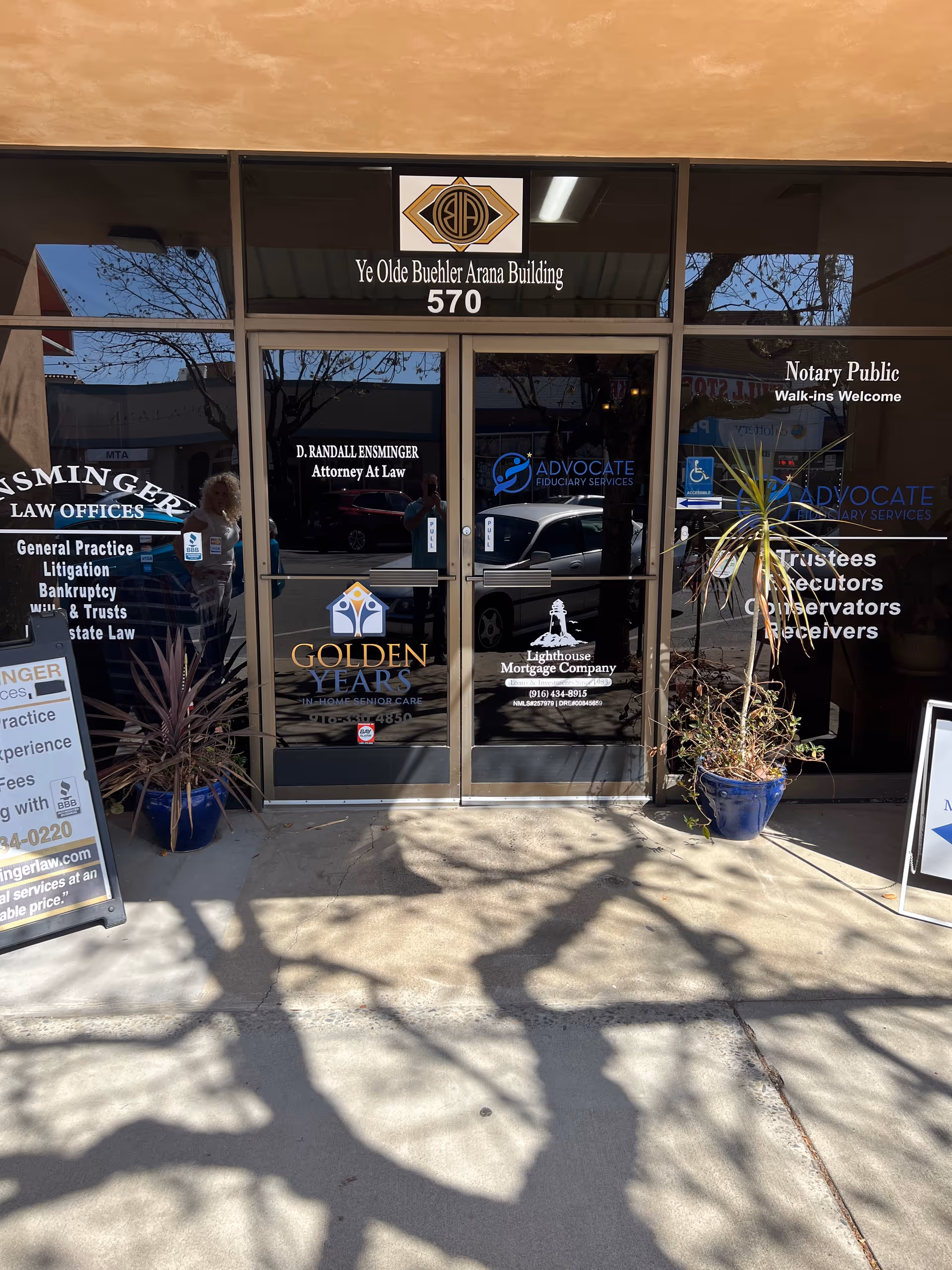 Front entrance of a building with business signs, including Golden Years In-Home Senior Care.