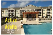 Exterior view of a multi-story senior living building with an outdoor pool.