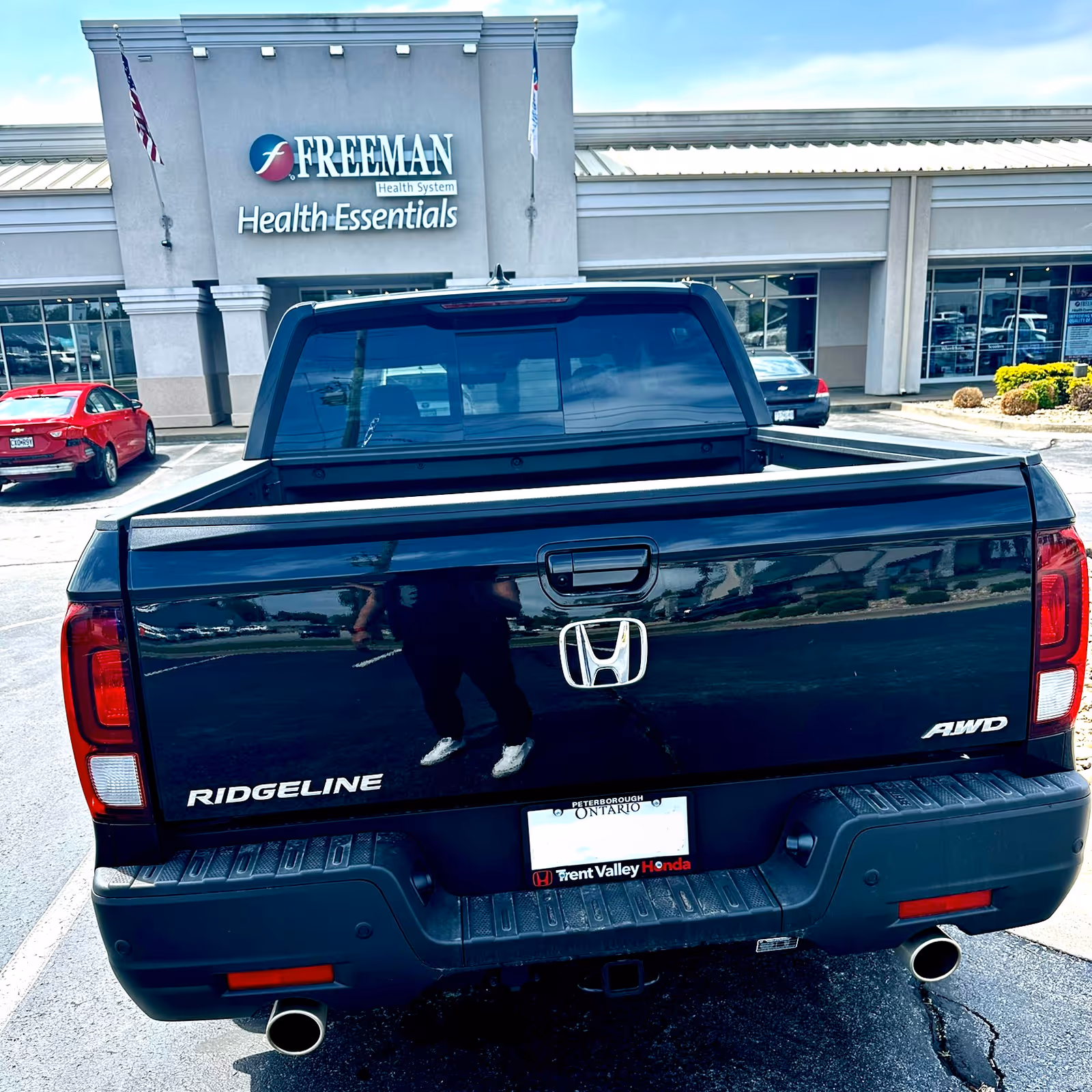 Black Honda Ridgeline pickup parked in front of Freeman Health Essentials Joplin facility.