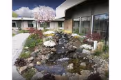 Front exterior courtyard of Good Samaritan Health Care Center features a rock waterfall.