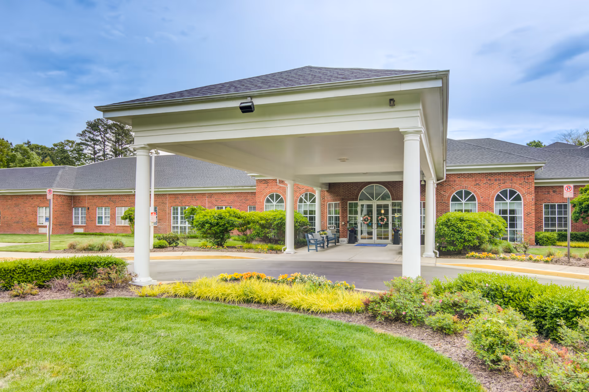 Commonwealth Senior Living at Cedar Manor: brick building with a covered entrance and landscaped grounds.