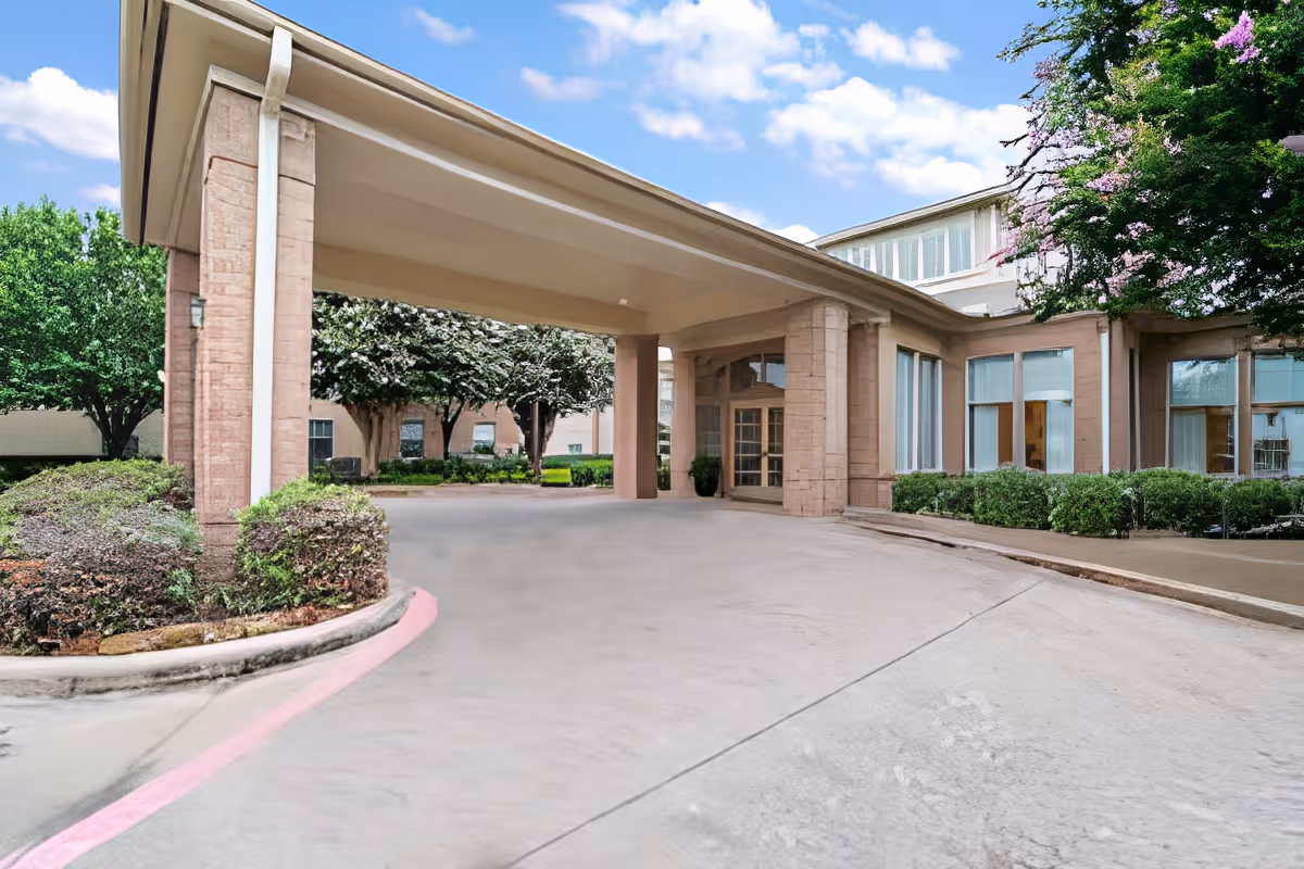 Entrance of Morada Deer Park senior living facility with landscaped surroundings.