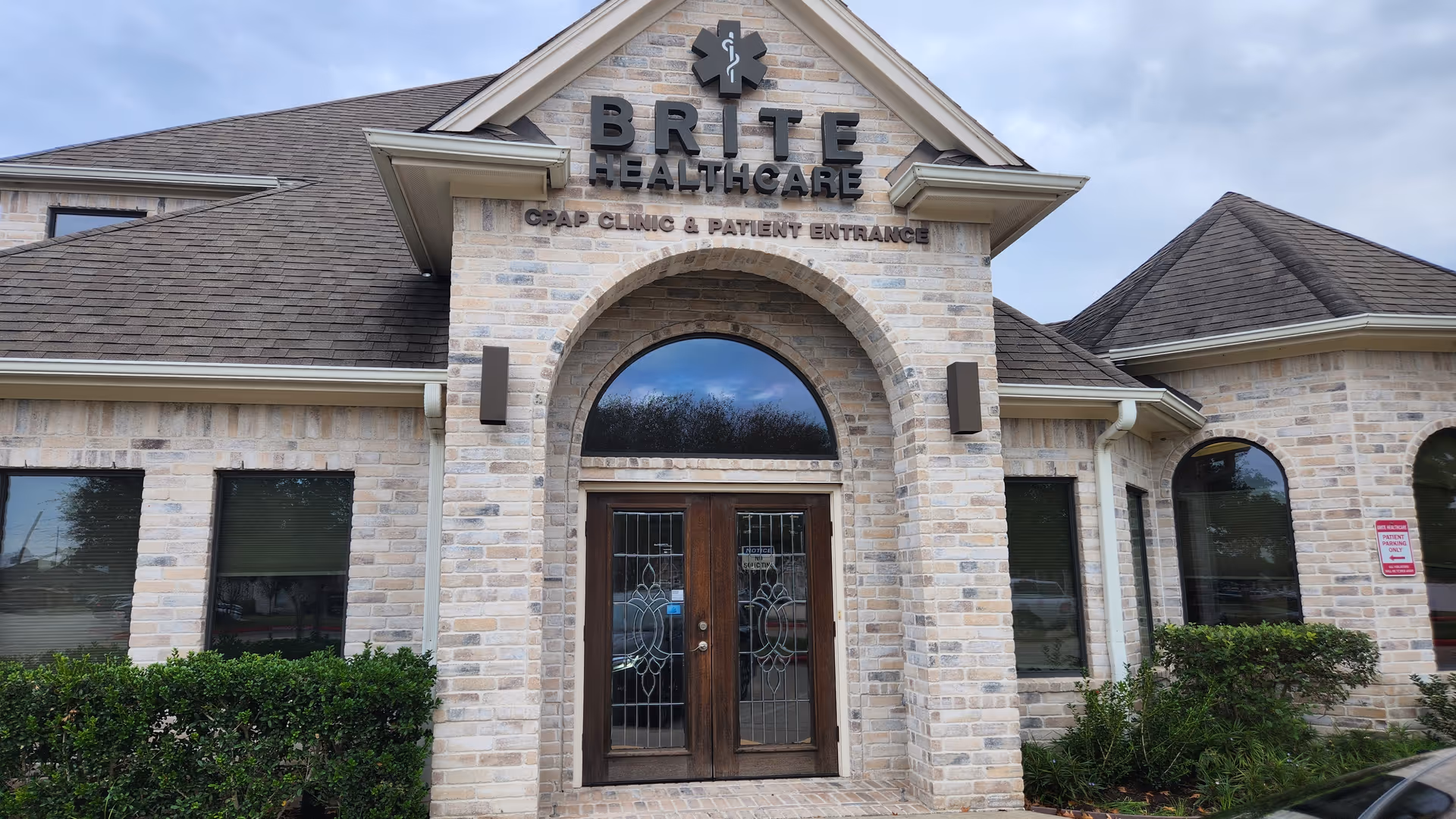 Exterior brick building with arched entrance and BRITE HEALTHCARE sign.
