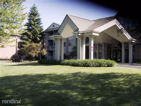 Exterior view of Porthaven Manor senior living facility with a covered entrance