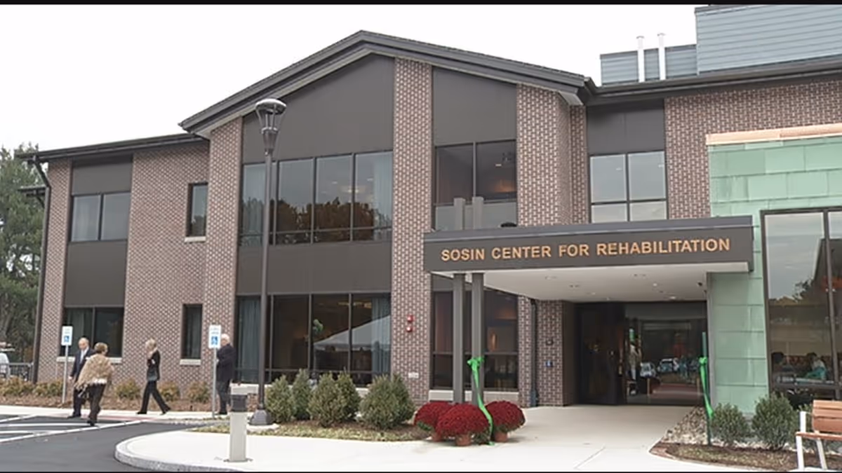 Exterior view of Sosin Center for Rehabilitation with glass entrance and signage.