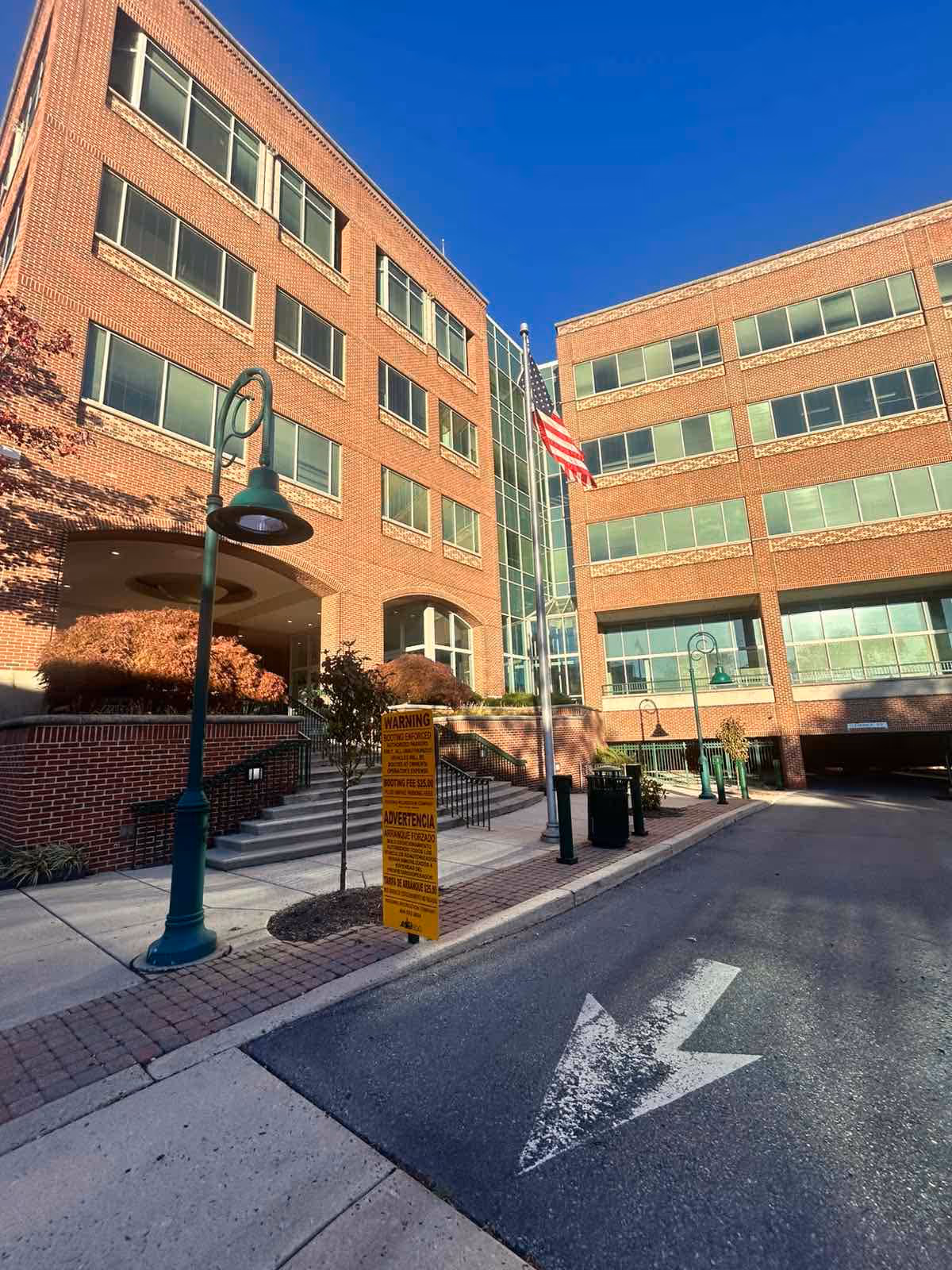 All American Home Care building exterior with entrance and flagpole.