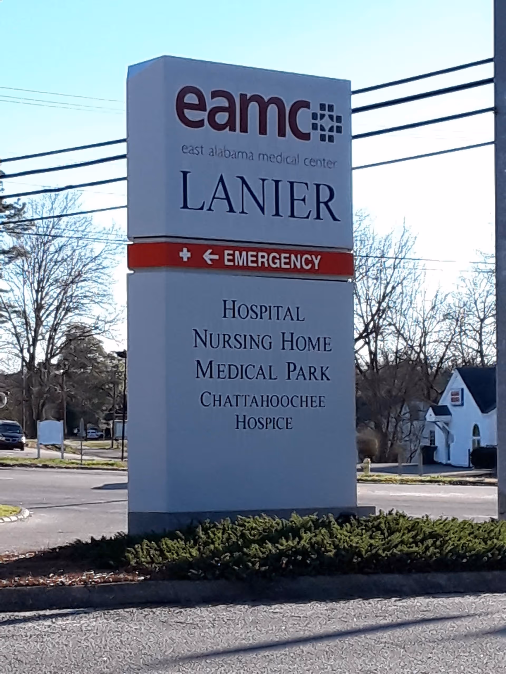 Tall outdoor sign for EAMC Lanier with Emergency arrow