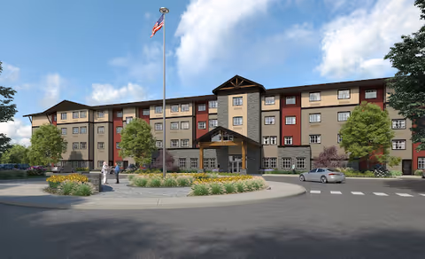 Exterior view of Fieldstone on Clear Creek, a multi-story senior living facility with a roundabout.
