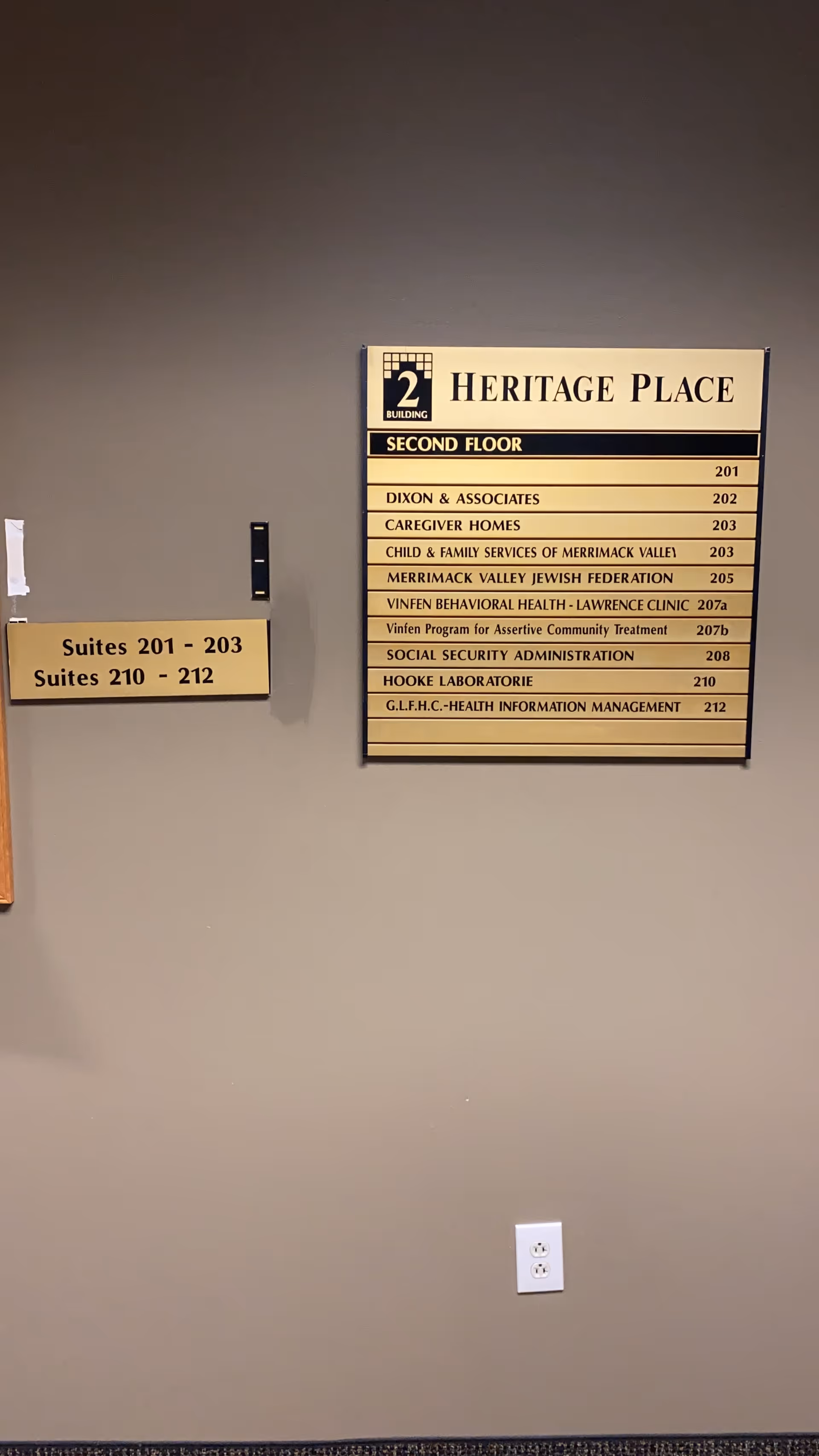 Interior hallway wall with a directory listing suites and departments at Heritage Place.