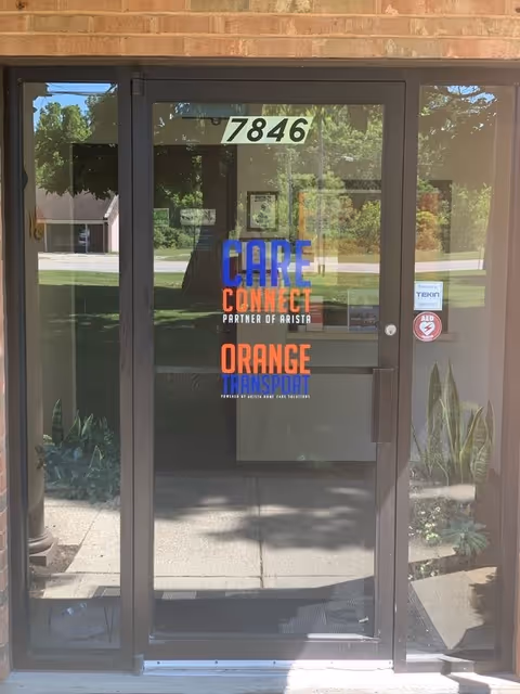 Front glass entrance door displaying Care Connect logo at Arista Home Care Solutions