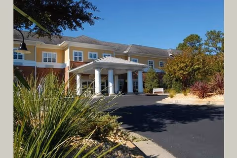 Exterior view of Morningside of Wilmington's entrance building with columns and landscaping.