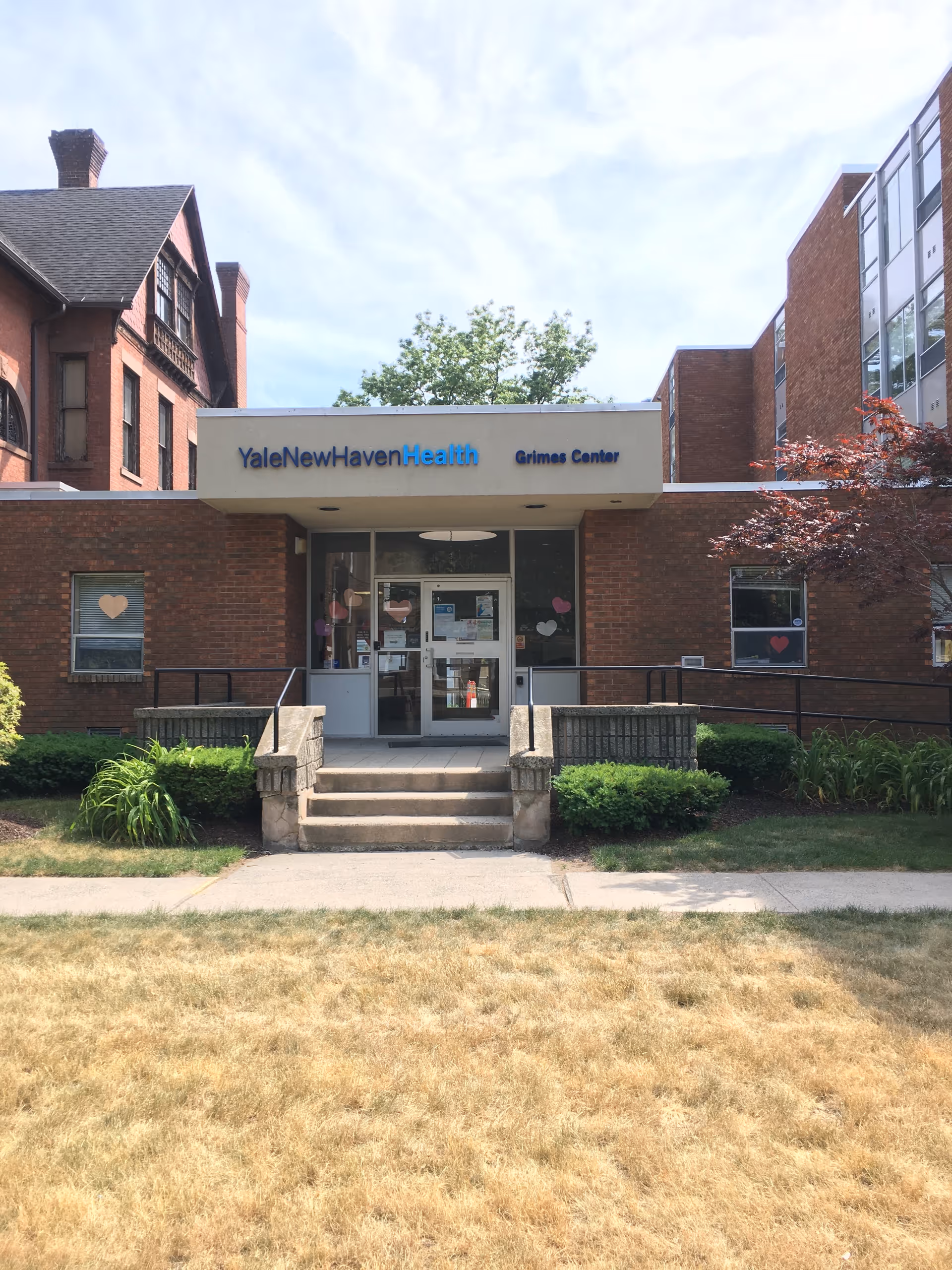 Brick facility with YaleNewHavenHealth Grimes Center entrance and steps.