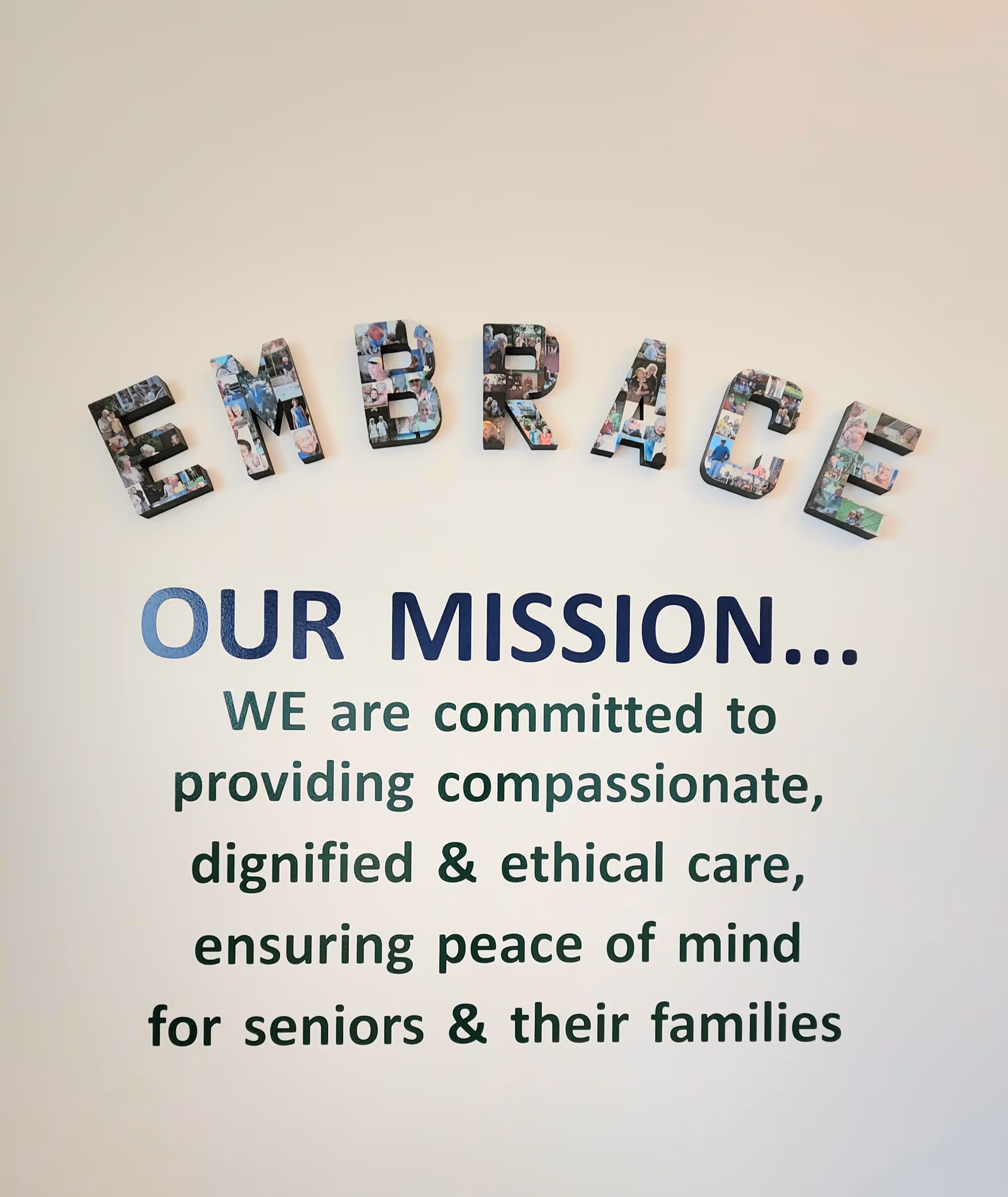 Interior wall featuring Embrace branding and a mission statement about compassionate senior care.
