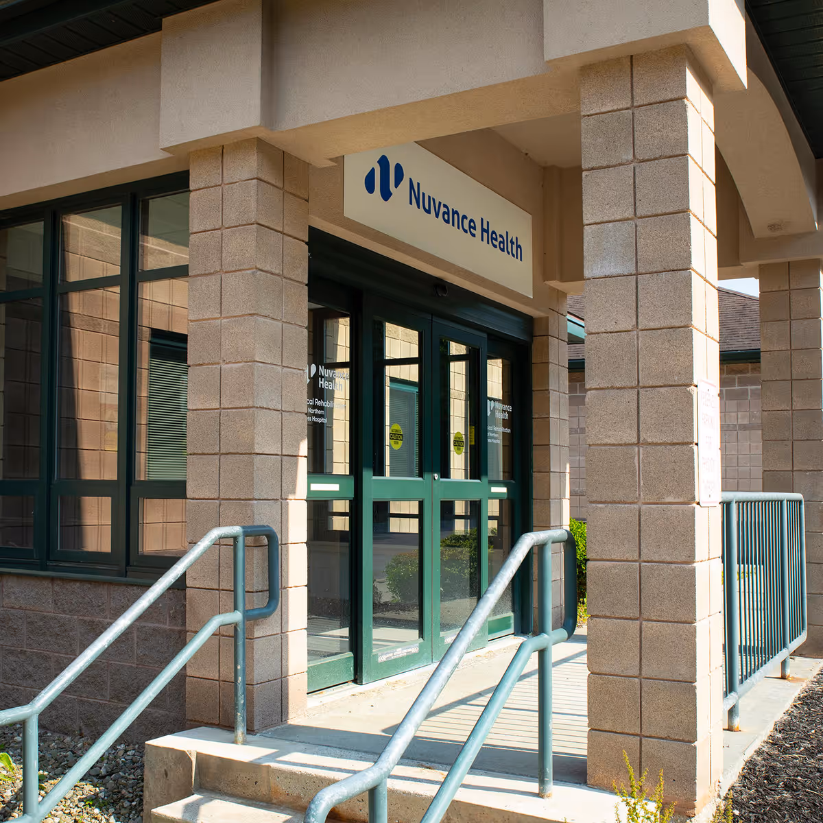 Exterior view of Nuvance Health entrance with green doors.