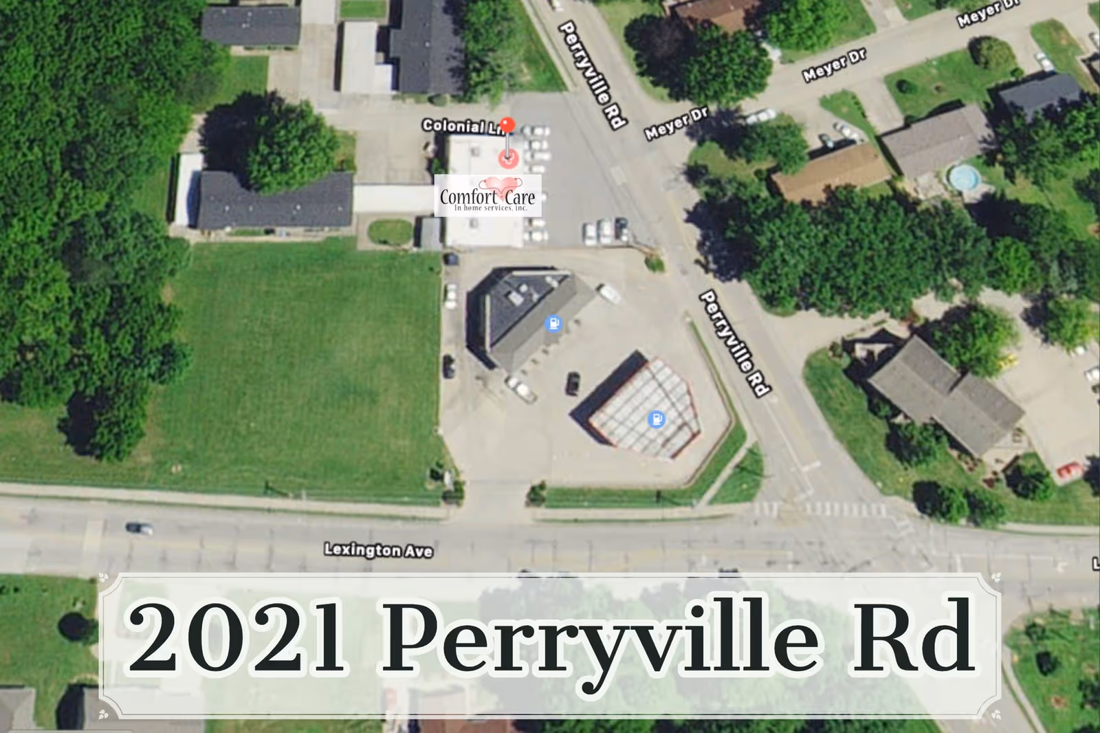 Aerial view of Comfort Care In Home Services building with parking lot and street.