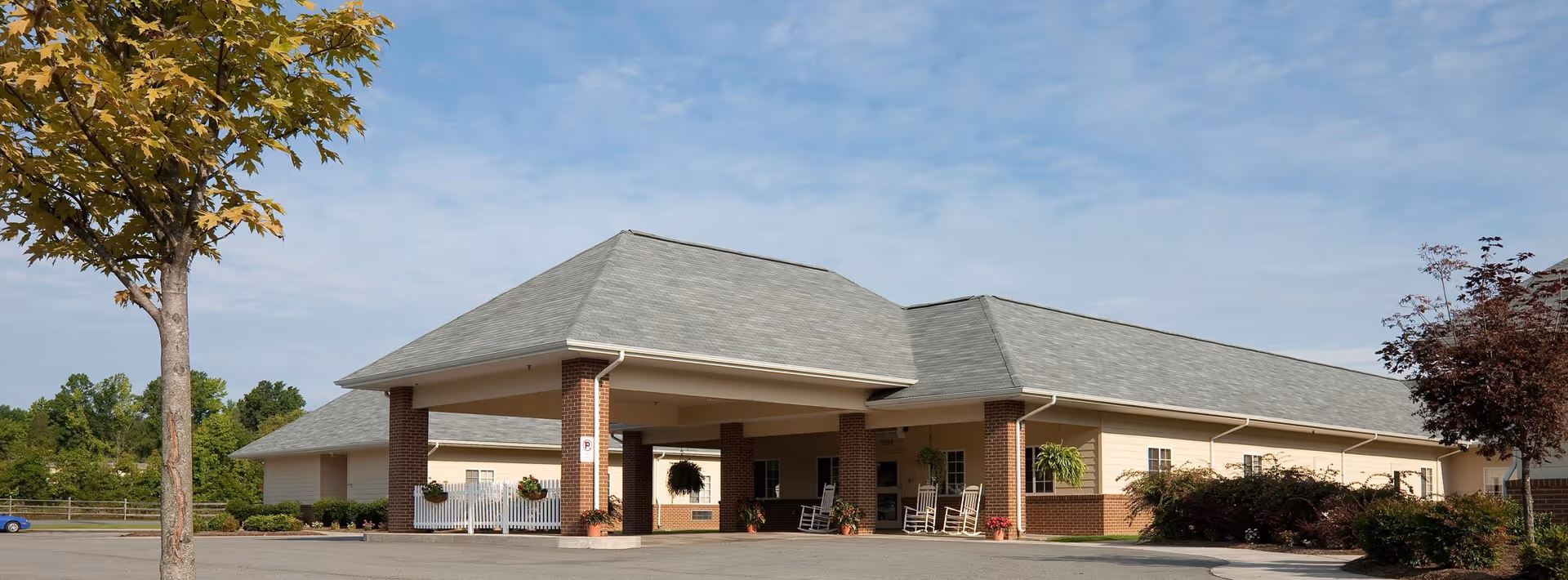 Exterior view of Chase City Health and Rehab Center entrance with a covered entry and landscaping.