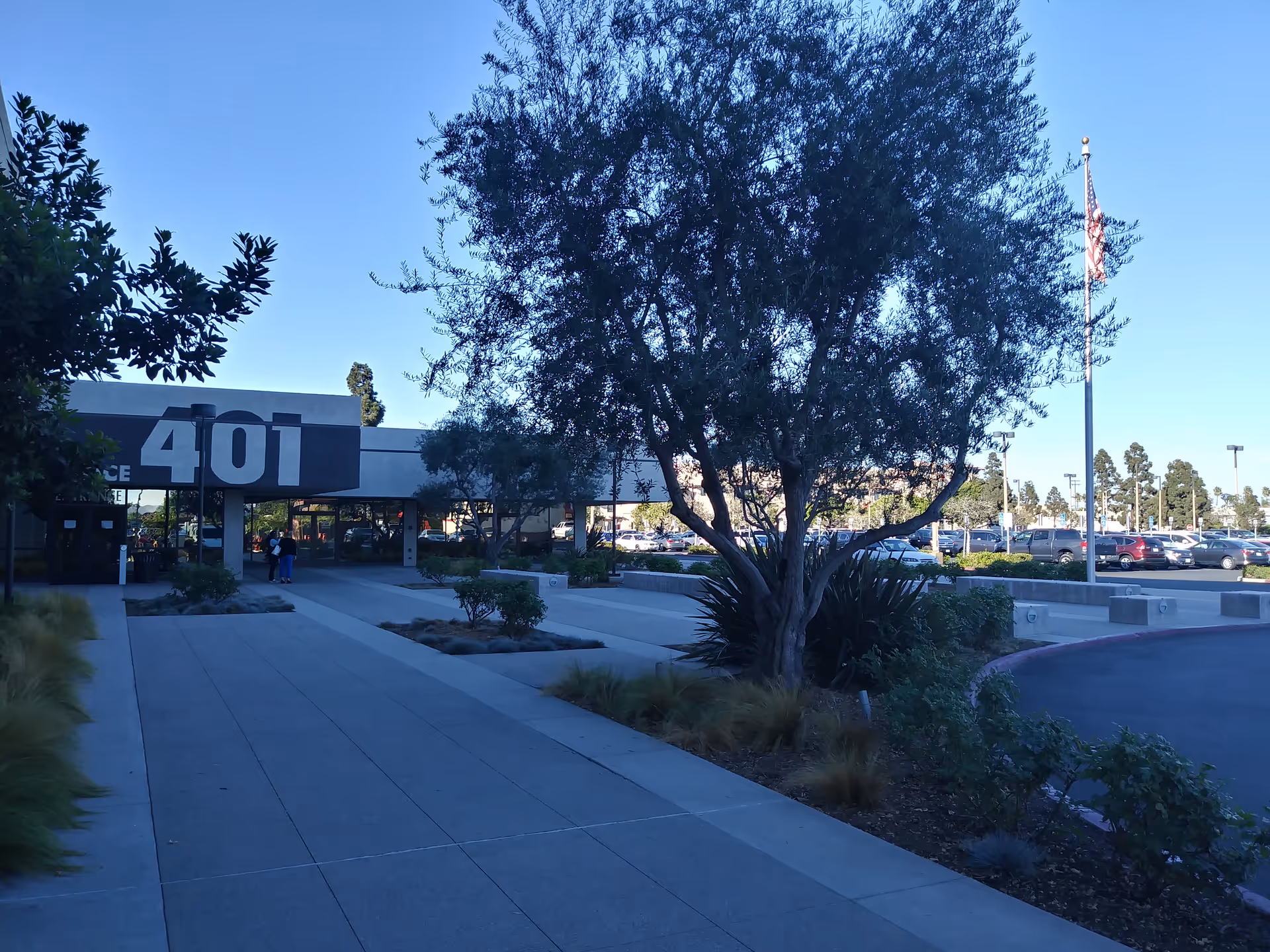 Exterior view of San Diego IHSS Public Authority building entrance with a large 401 sign.