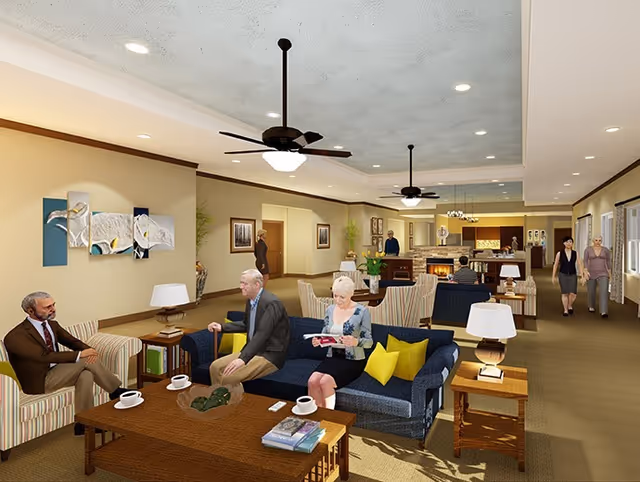 Spacious senior living common area with sofas, armchairs, coffee tables, lamps, ceiling fans, and residents socializing.