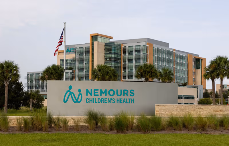 Exterior view of Nemours Children's Health Lake Nona Medical City building and sign