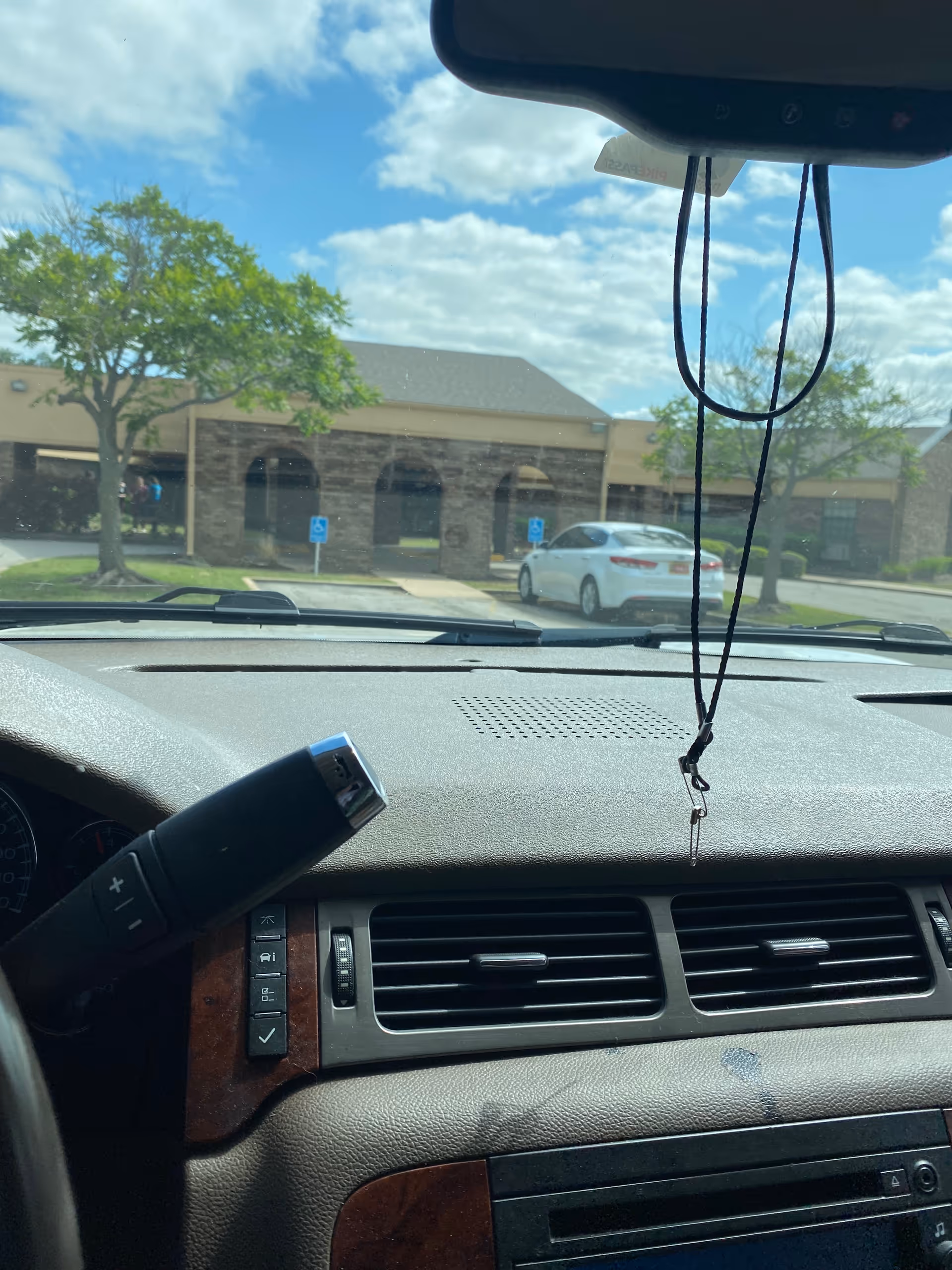 Dashboard view from car showing Glenwood Skilled Nursing & Therapy building exterior.