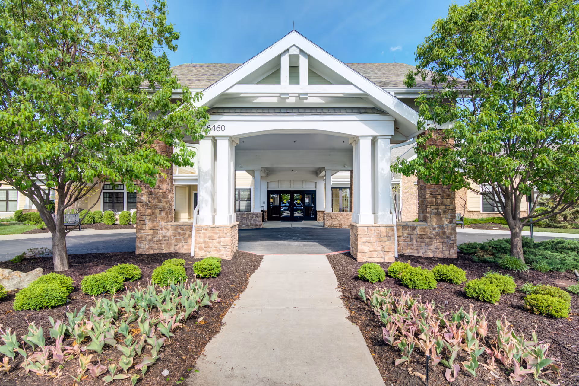 Senior Star at Wexford Place exterior entrance with landscaped path and trees.