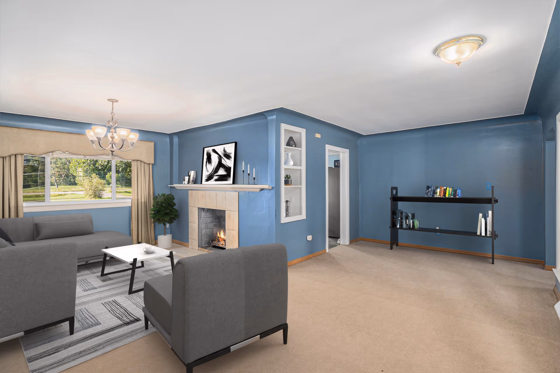 Blue-walled living room with gray sofas, fireplace, and window.