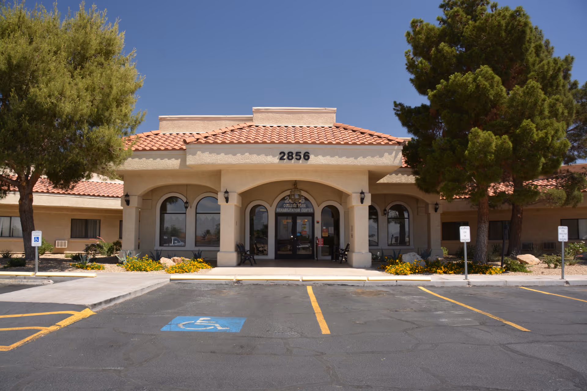 Front view of College Park Rehabilitation Center building with a handicapped parking space