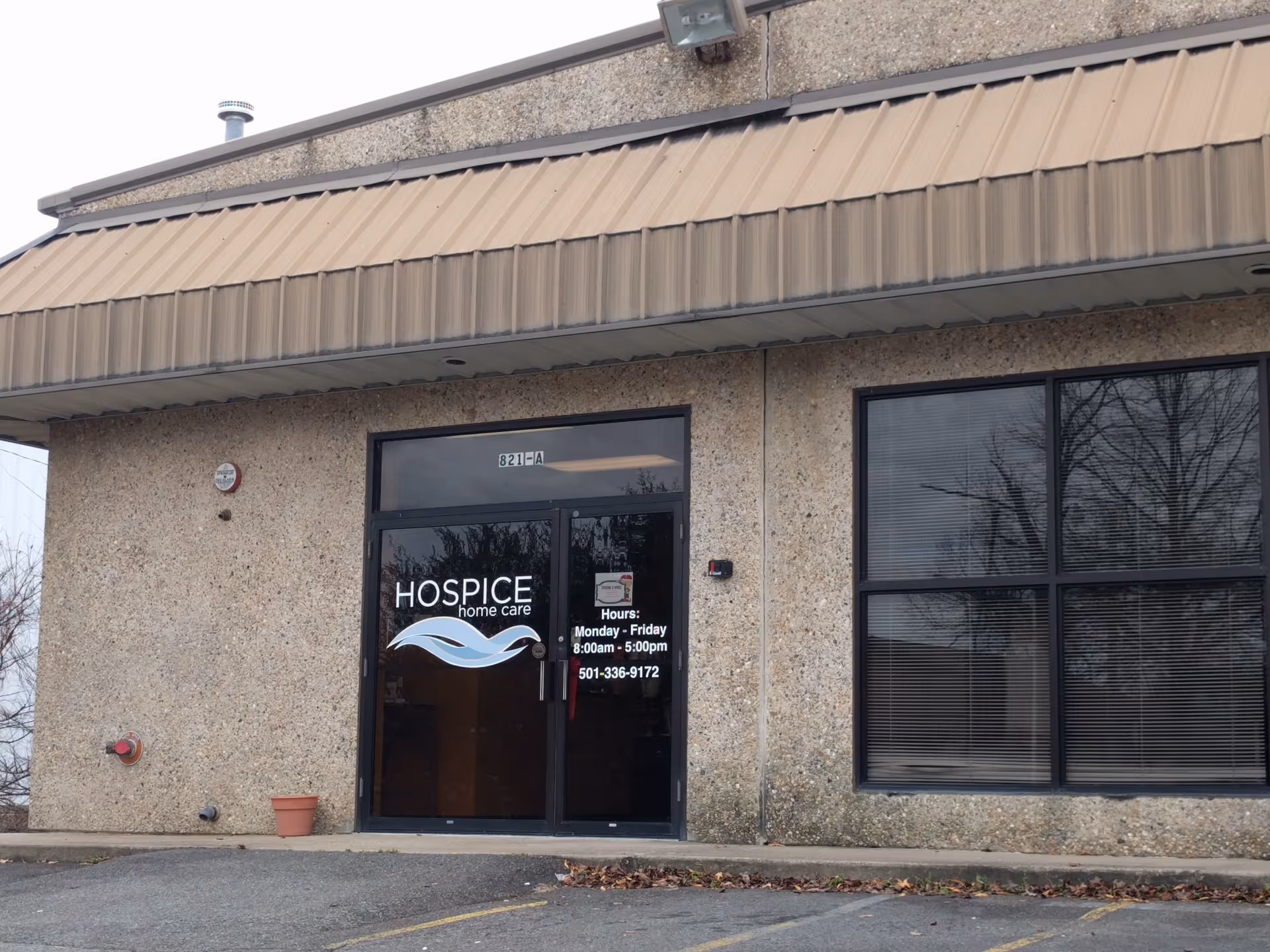 Exterior view of a Hospice home care entrance with glass doors