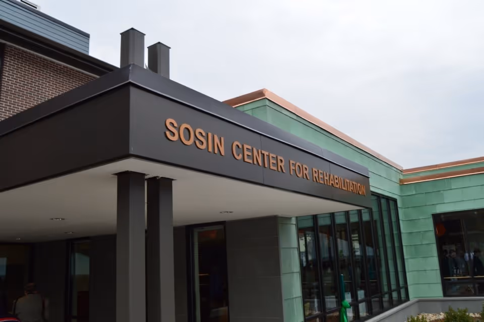 Exterior view of the Sosin Center for Rehabilitation entrance with modern glass doors.